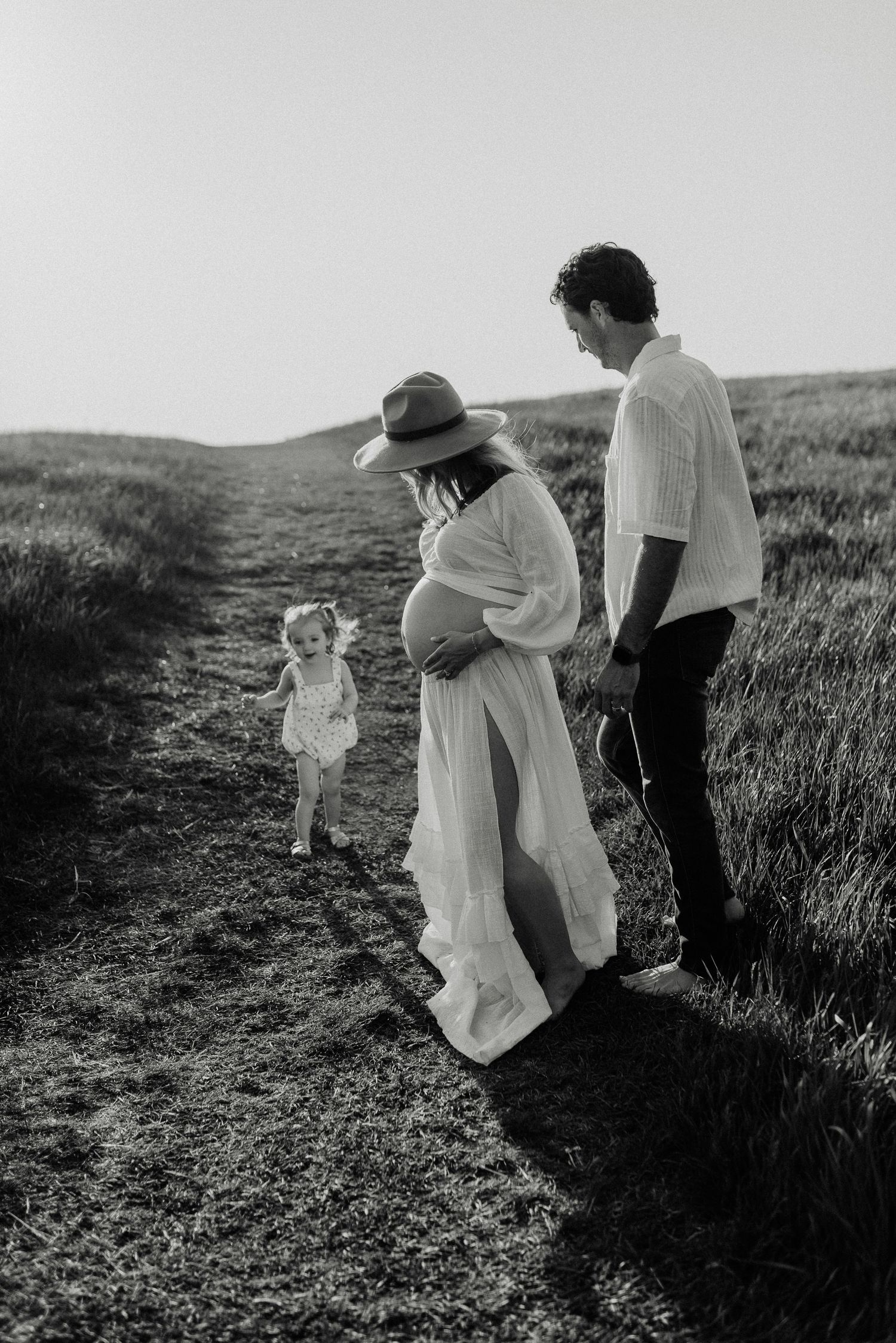 Edmonton maternity photography session of pregnant woman in soft natural light, capturing her pregnancy glow.