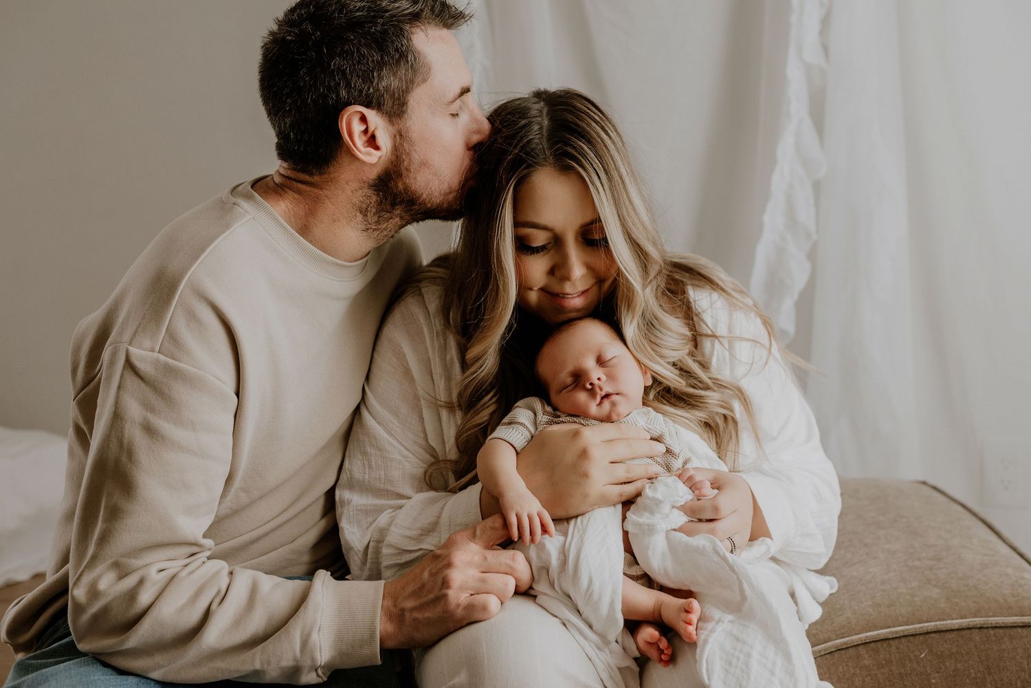Close-up of newborn hands and feet in Edmonton studio, showcasing professional newborn photography style.