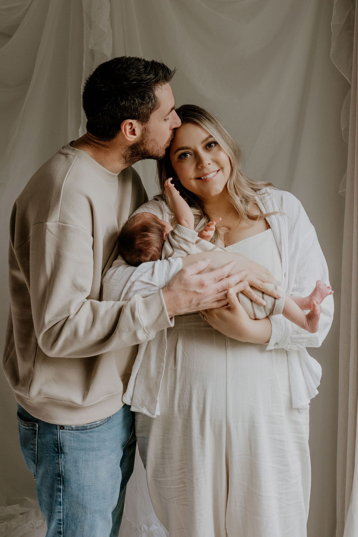 Close-up of newborn hands and feet in Edmonton studio, showcasing professional newborn photography style.