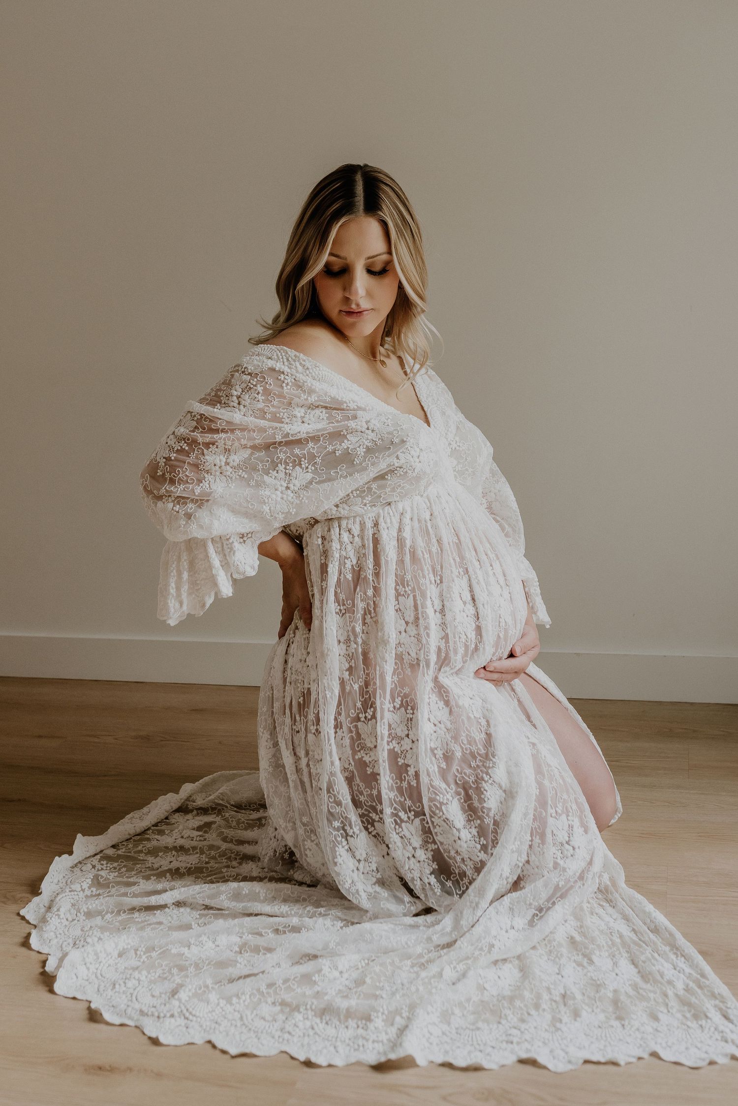 Studio maternity portrait of expecting mother in Edmonton, Alberta, showcasing elegant and timeless pregnancy photos.