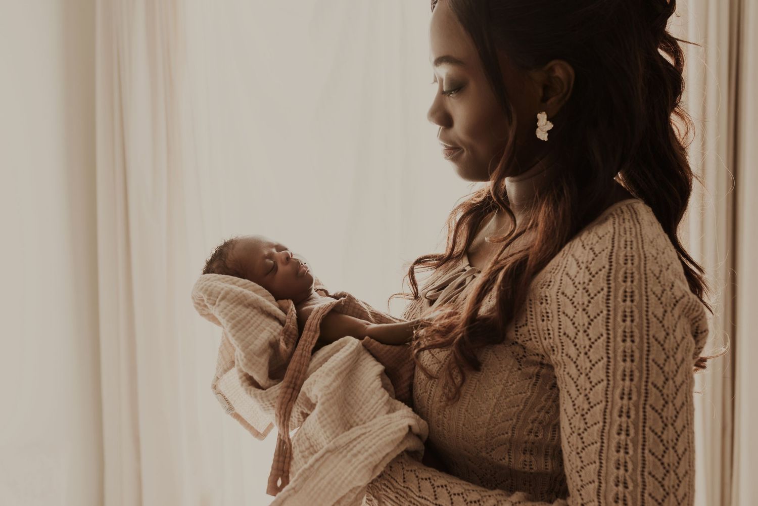 Sleeping newborn in studio photography session in Edmonton, Alberta, capturing peaceful early life moments.