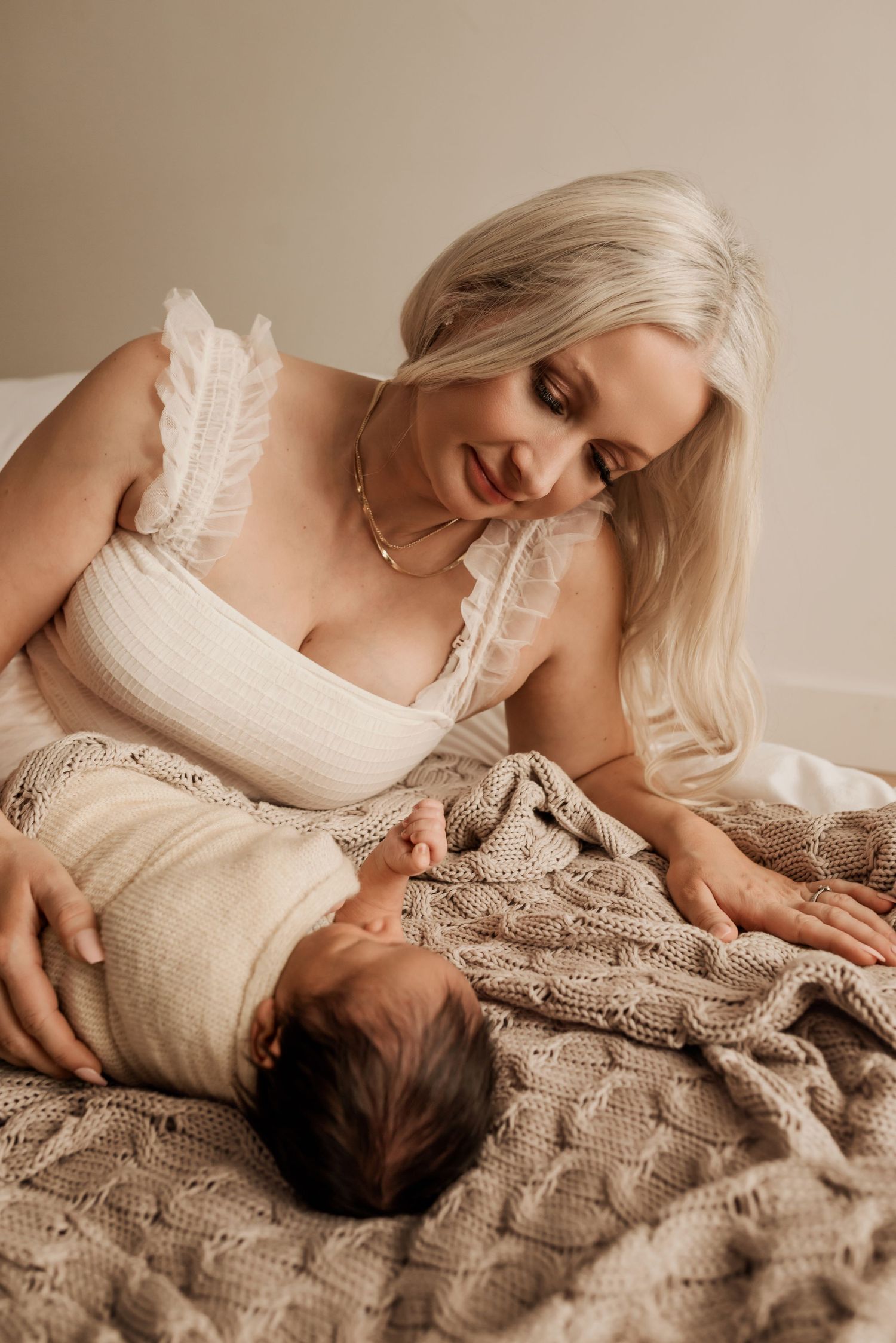 Sleeping newborn in studio photography session in Edmonton, Alberta, capturing peaceful early life moments.