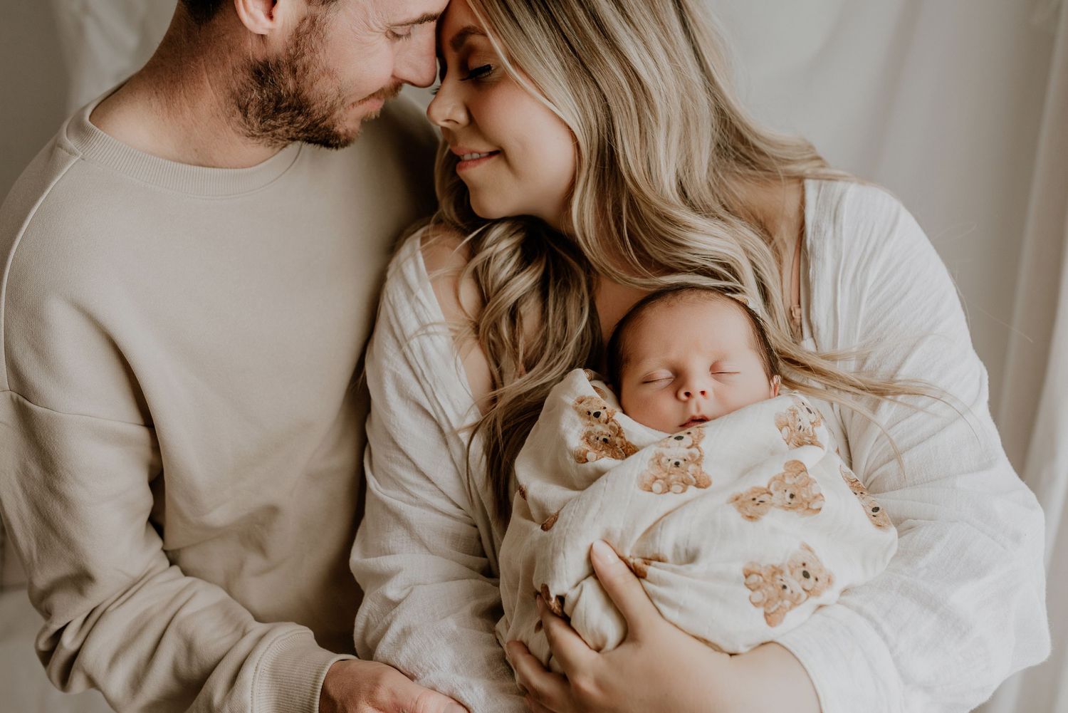 Heart and Gable newborn photography of baby wrapped in soft blanket, highlighting delicate details and innocence.