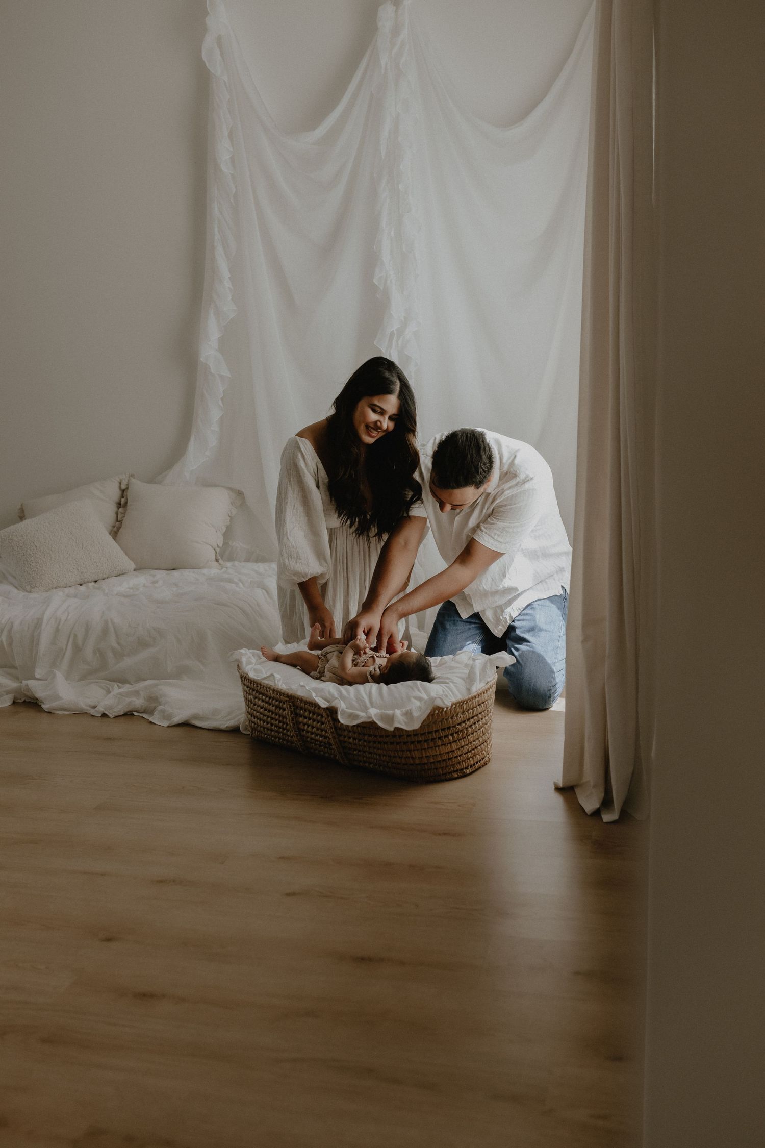 Adorable sleeping baby in cozy Edmonton studio setup, perfect example of newborn photography with soft lighting.