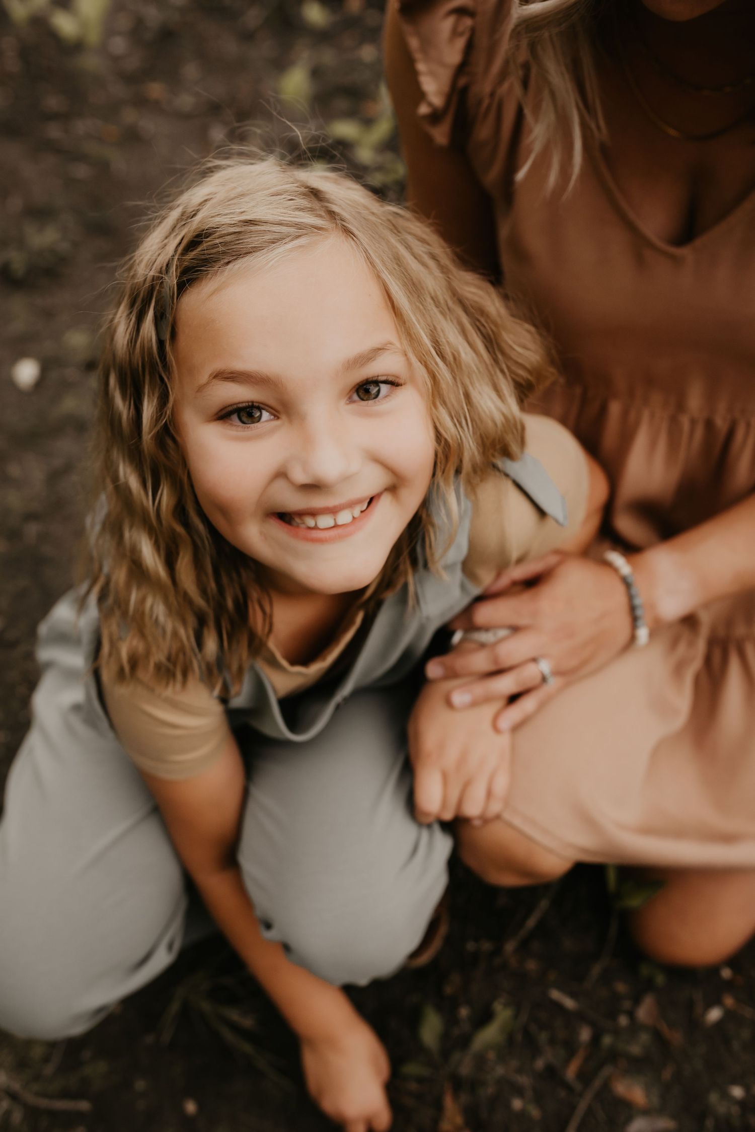 Family photography session in Edmonton, Alberta, capturing parents and children enjoying light-filled portraits.