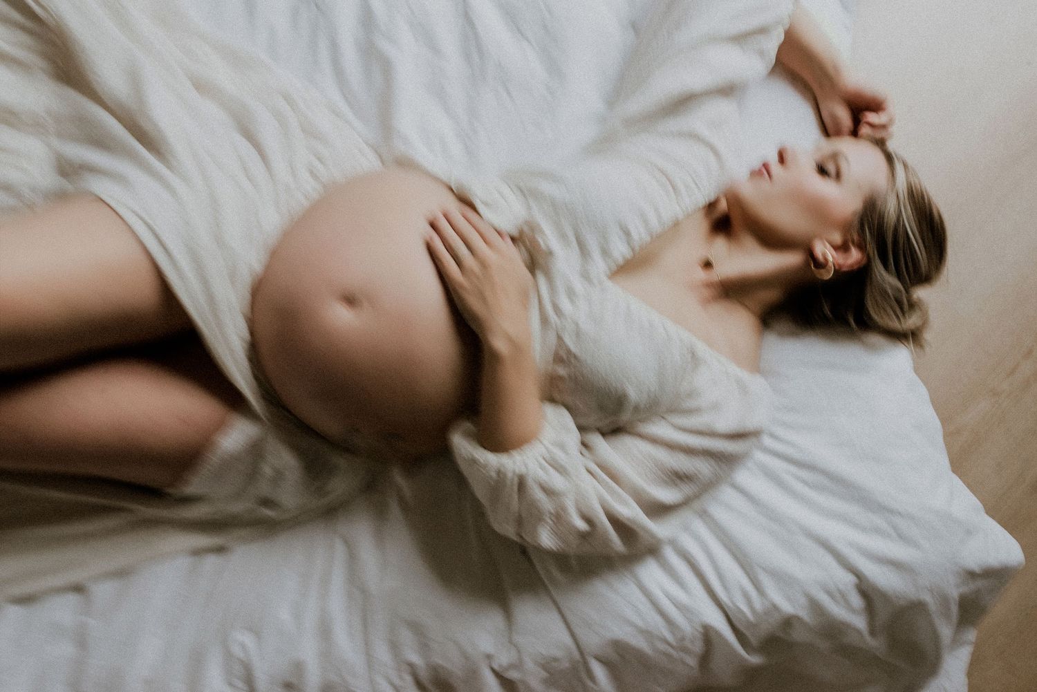 Studio maternity portrait of expecting mother in Edmonton, Alberta, showcasing elegant and timeless pregnancy photos.