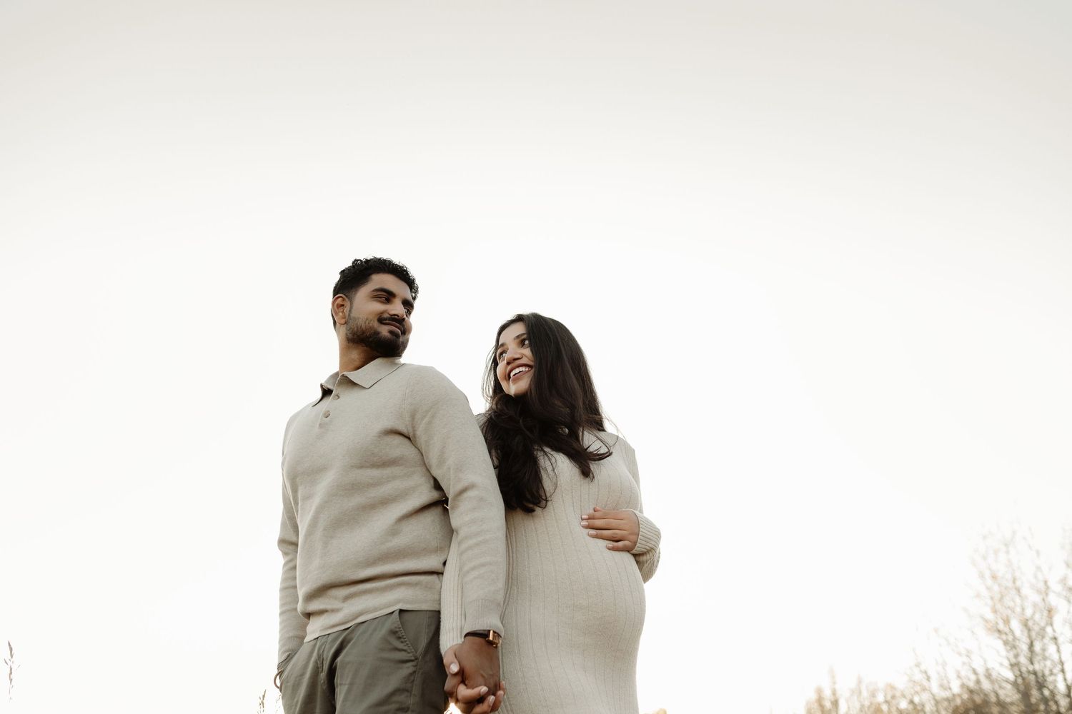 Outdoor maternity portrait of expecting mother in Edmonton, Alberta, showcasing elegant and timeless pregnancy photos.