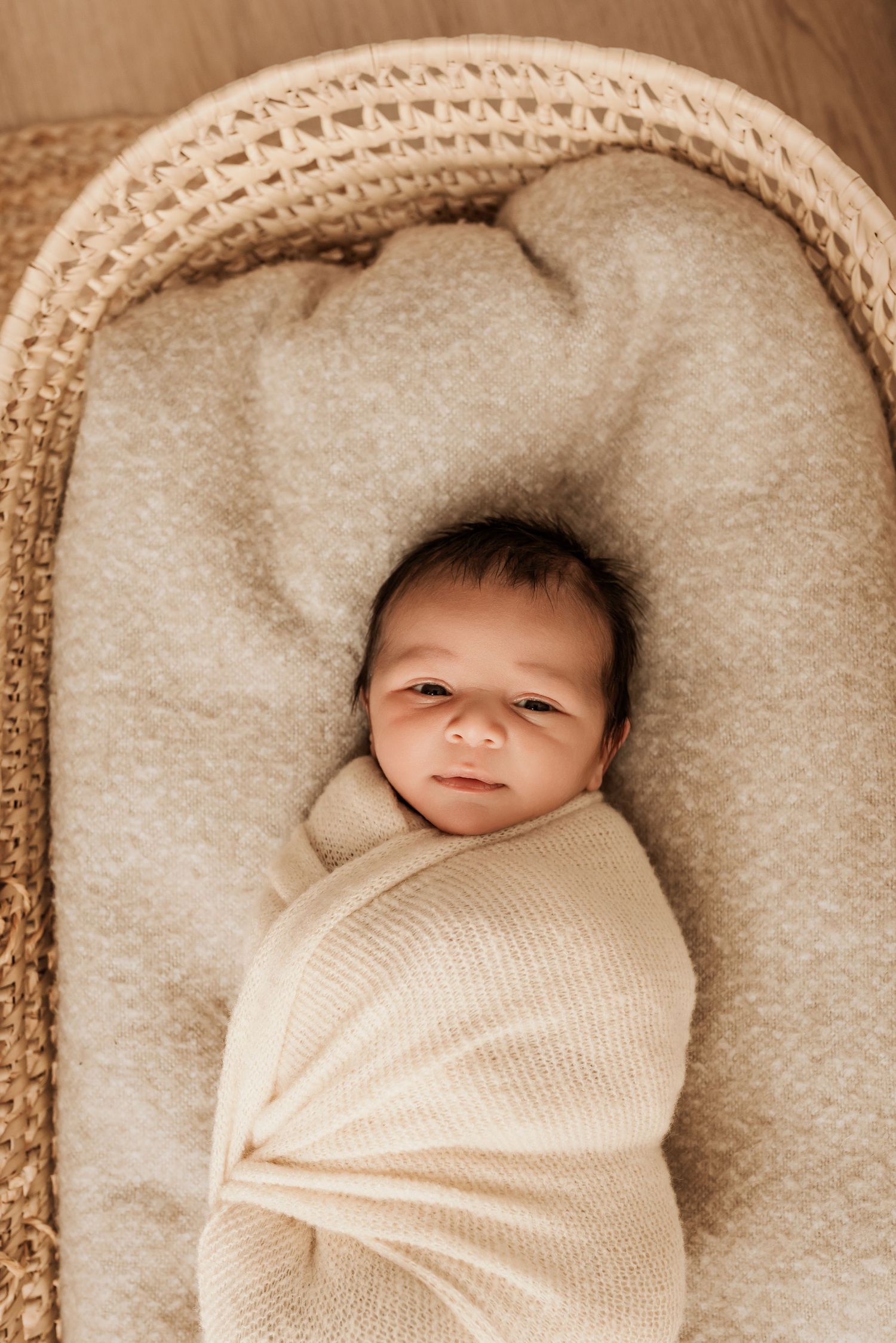 Newborn in studio photography session in Edmonton, Alberta, capturing peaceful early life moments.