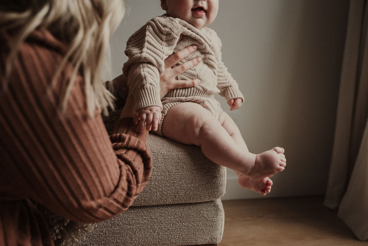 Close-up of newborn hands and feet in Edmonton studio, showcasing professional newborn photography style.