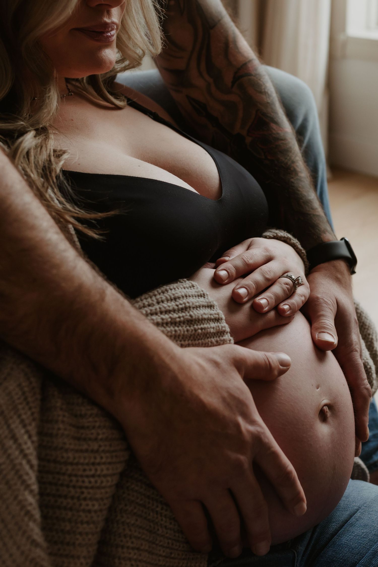 Edmonton maternity photography session of pregnant woman in soft natural light, capturing her pregnancy glow.