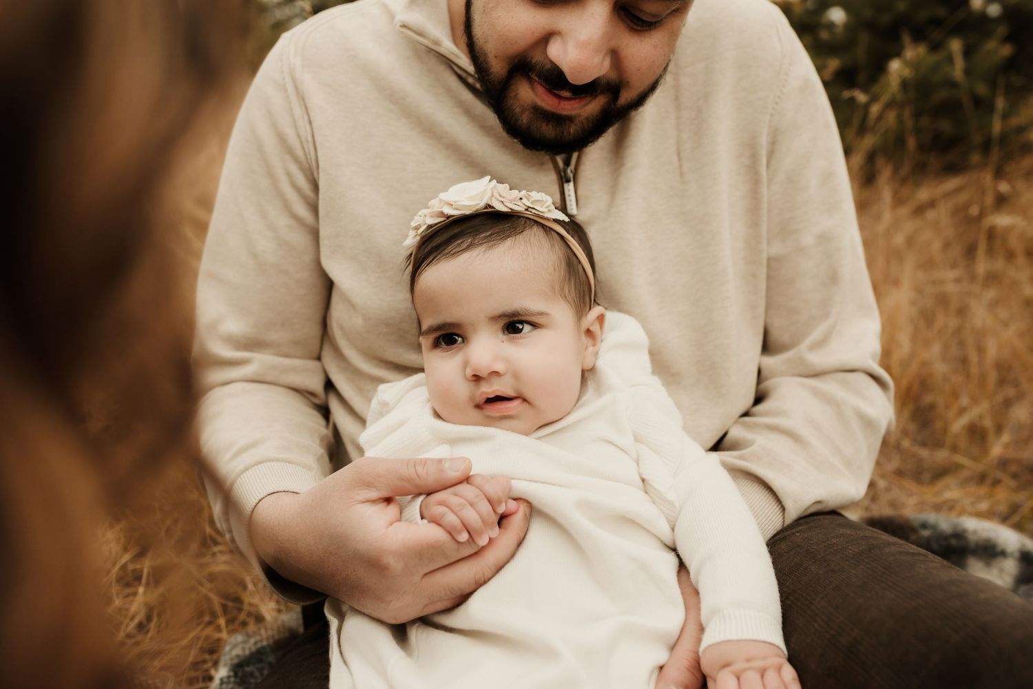 Outdoor newborn photography session in Edmonton, Alberta, capturing tiny details and family memories.