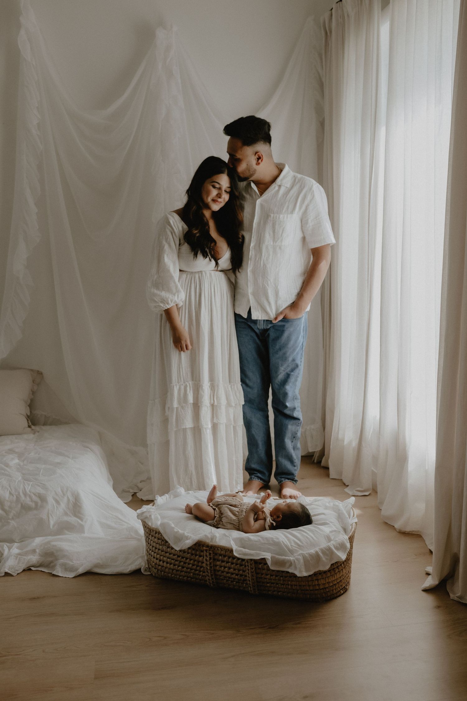 Adorable sleeping baby in cozy Edmonton studio setup, perfect example of newborn photography with soft lighting.