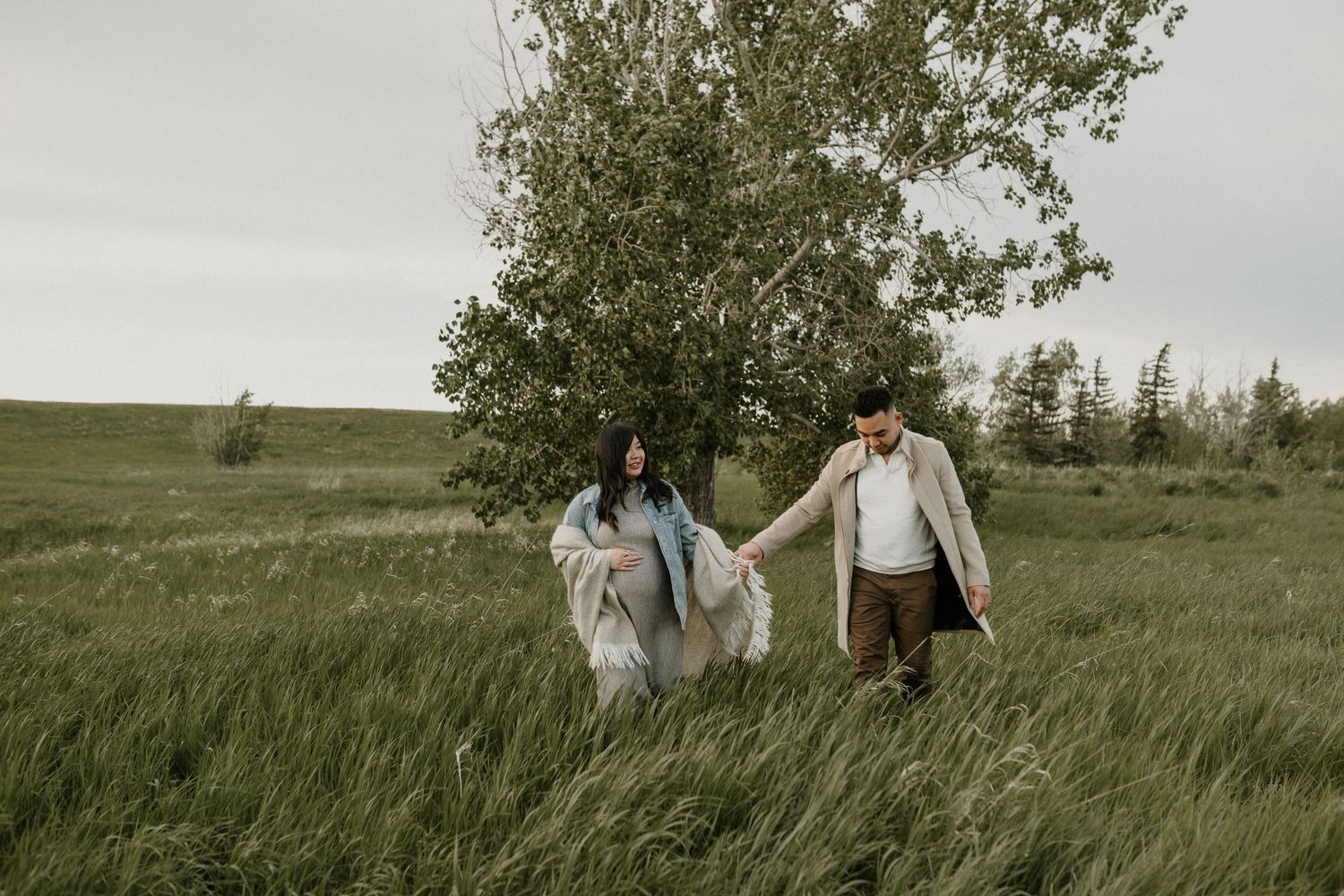 Outdoor maternity portrait of expecting mother in Edmonton, Alberta, showcasing elegant and timeless pregnancy photos.