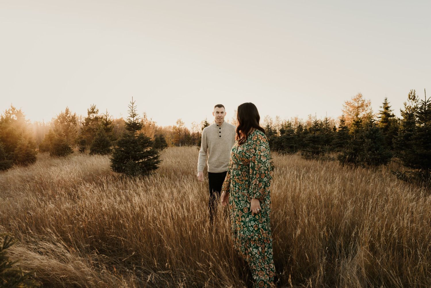 Family photography session in Edmonton, Alberta, capturing parents and children enjoying light-filled portraits.