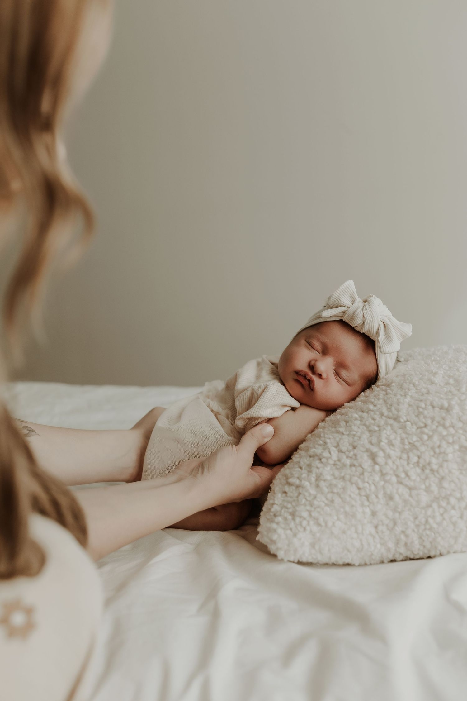 Sleeping newborn in studio photography session in Edmonton, Alberta, capturing peaceful early life moments.