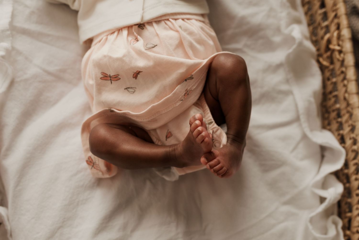 Close-up of newborn hands and feet in Edmonton studio, showcasing professional newborn photography style.