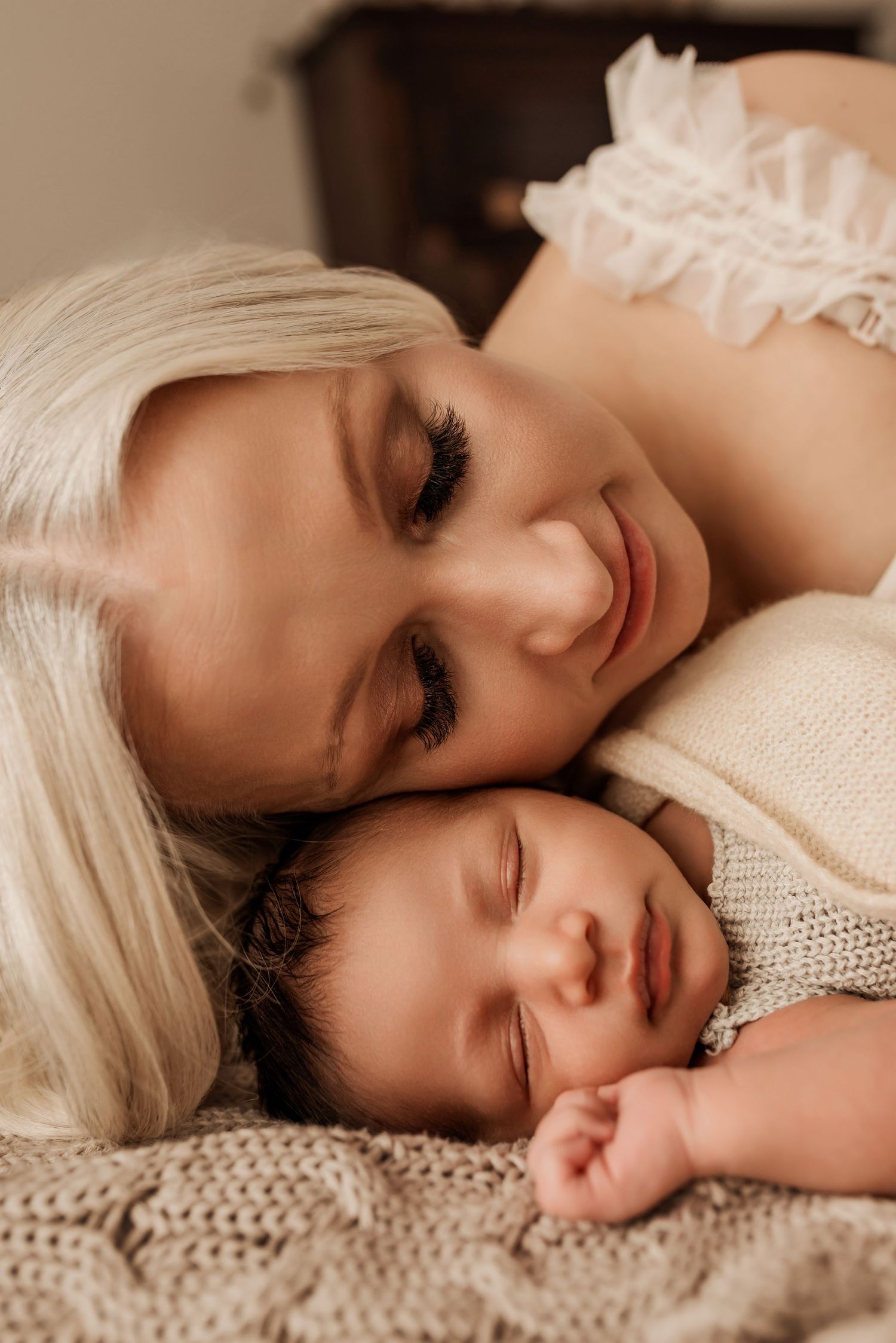 Sleeping newborn in studio photography session in Edmonton, Alberta, capturing peaceful early life moments.