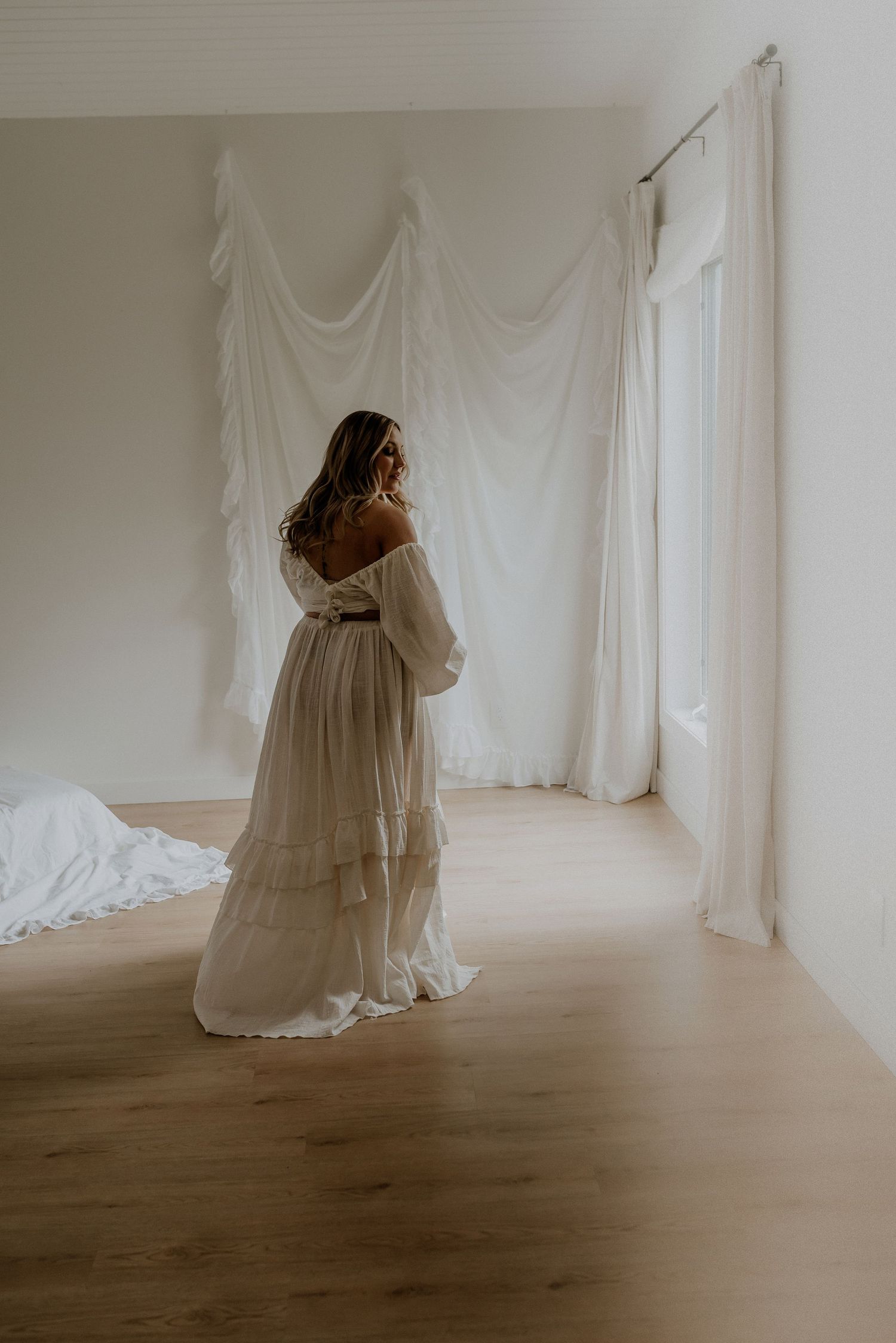 Studio maternity portrait of expecting mother in Edmonton, Alberta, showcasing elegant and timeless pregnancy photos.