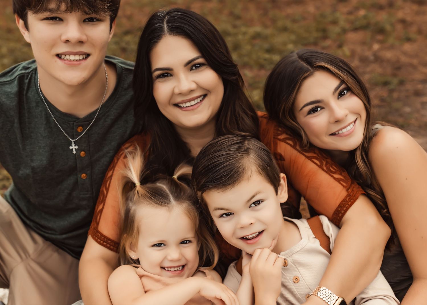 A collection of candid family portrait photos showing joyful moments and warm embraces outdoors.