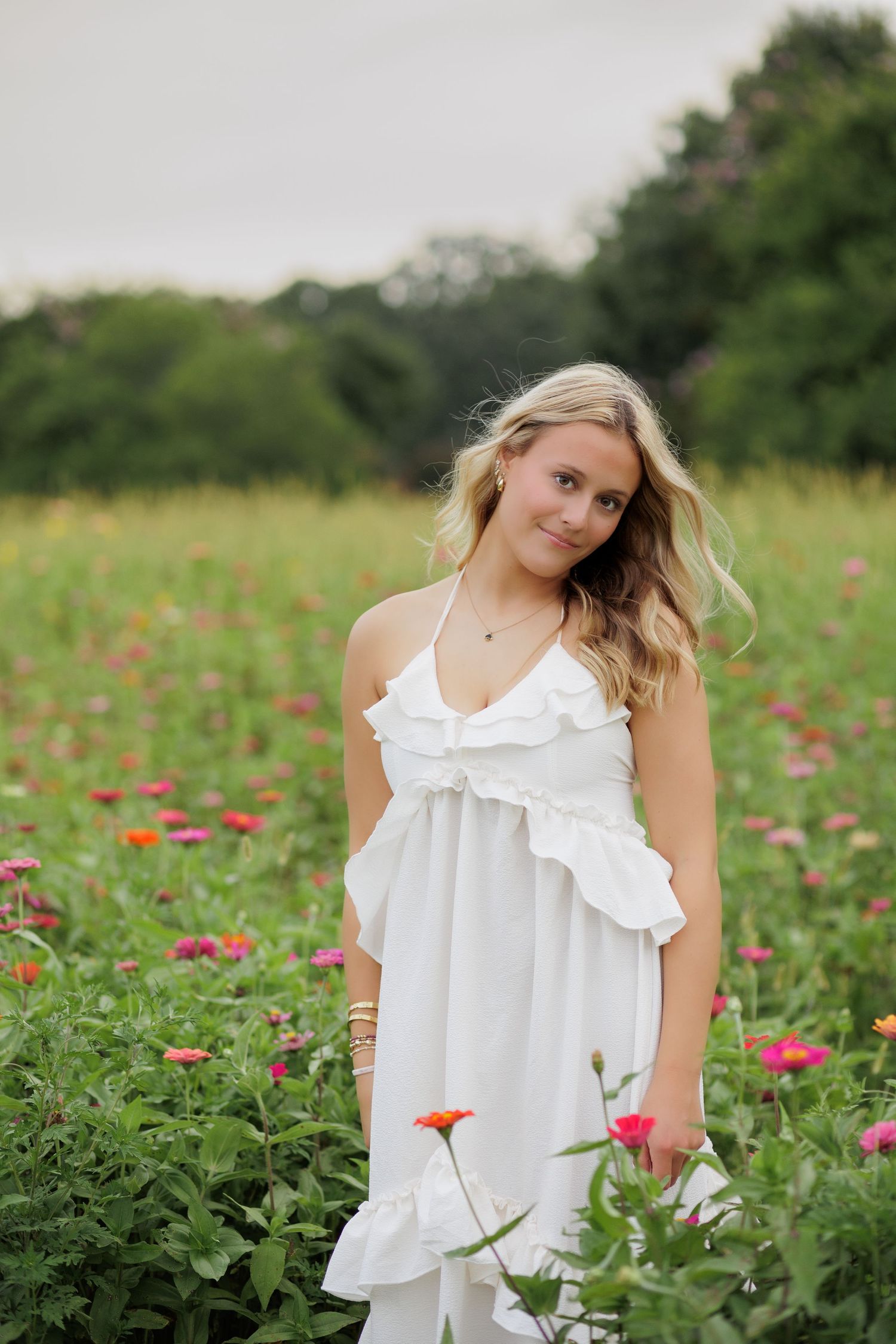 Wake Forest Senior Portraits in a flower field at Dix Park in Raleigh, NC Golden Hour