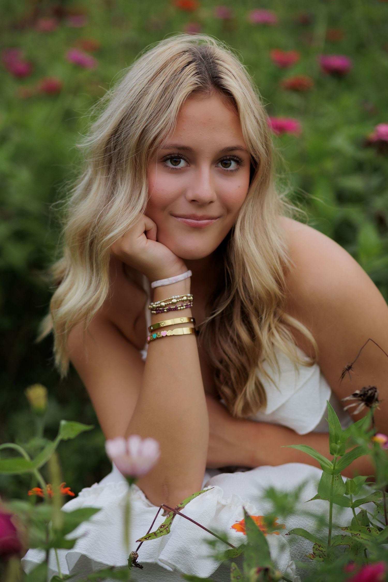 Wake Forest Senior Portraits in a flower field at Dix Park in Raleigh, NC Golden Hour