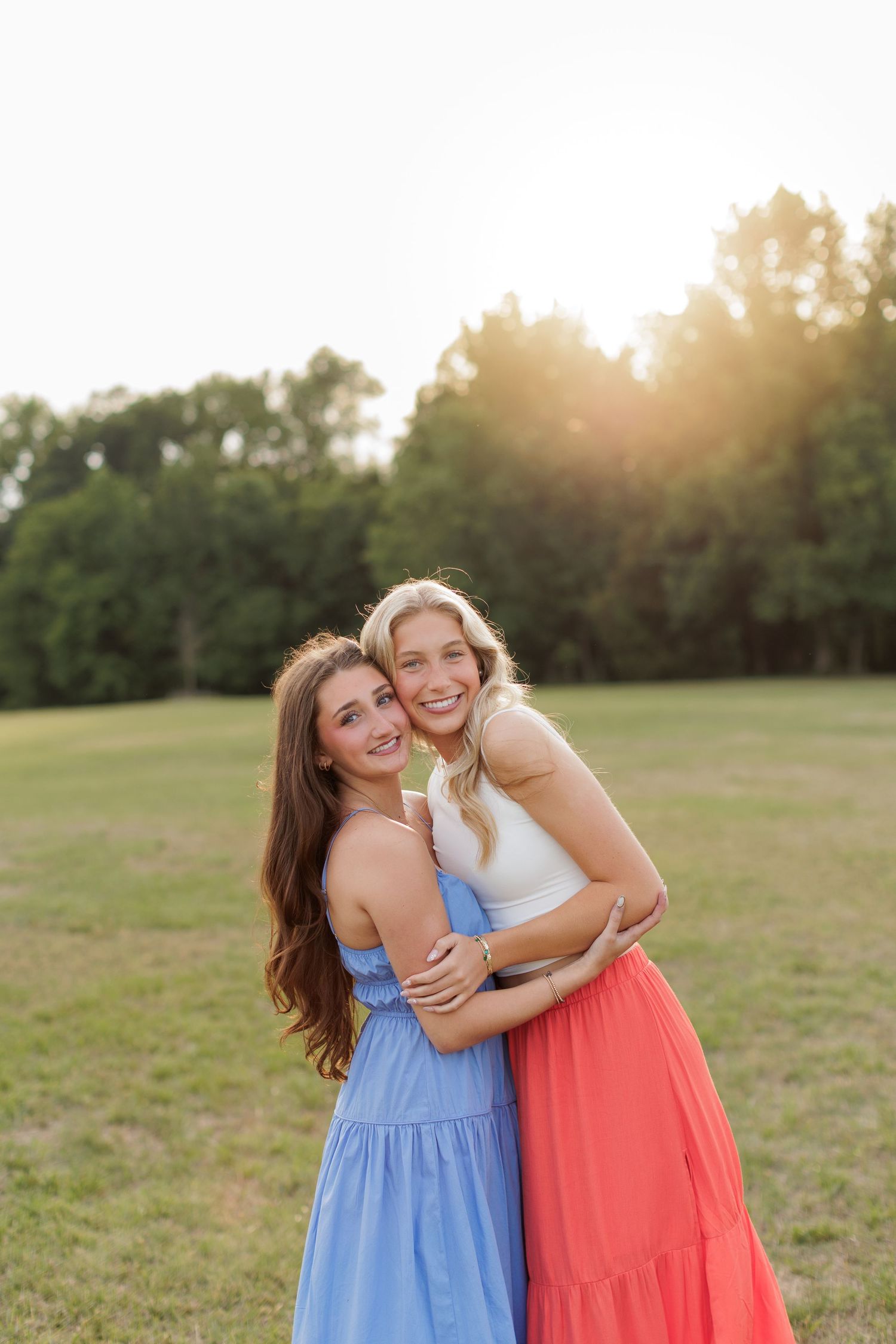 Wake Forest Best Friend Senior Session at Horseshoe Farm in field at sunset in Raleigh, NC.