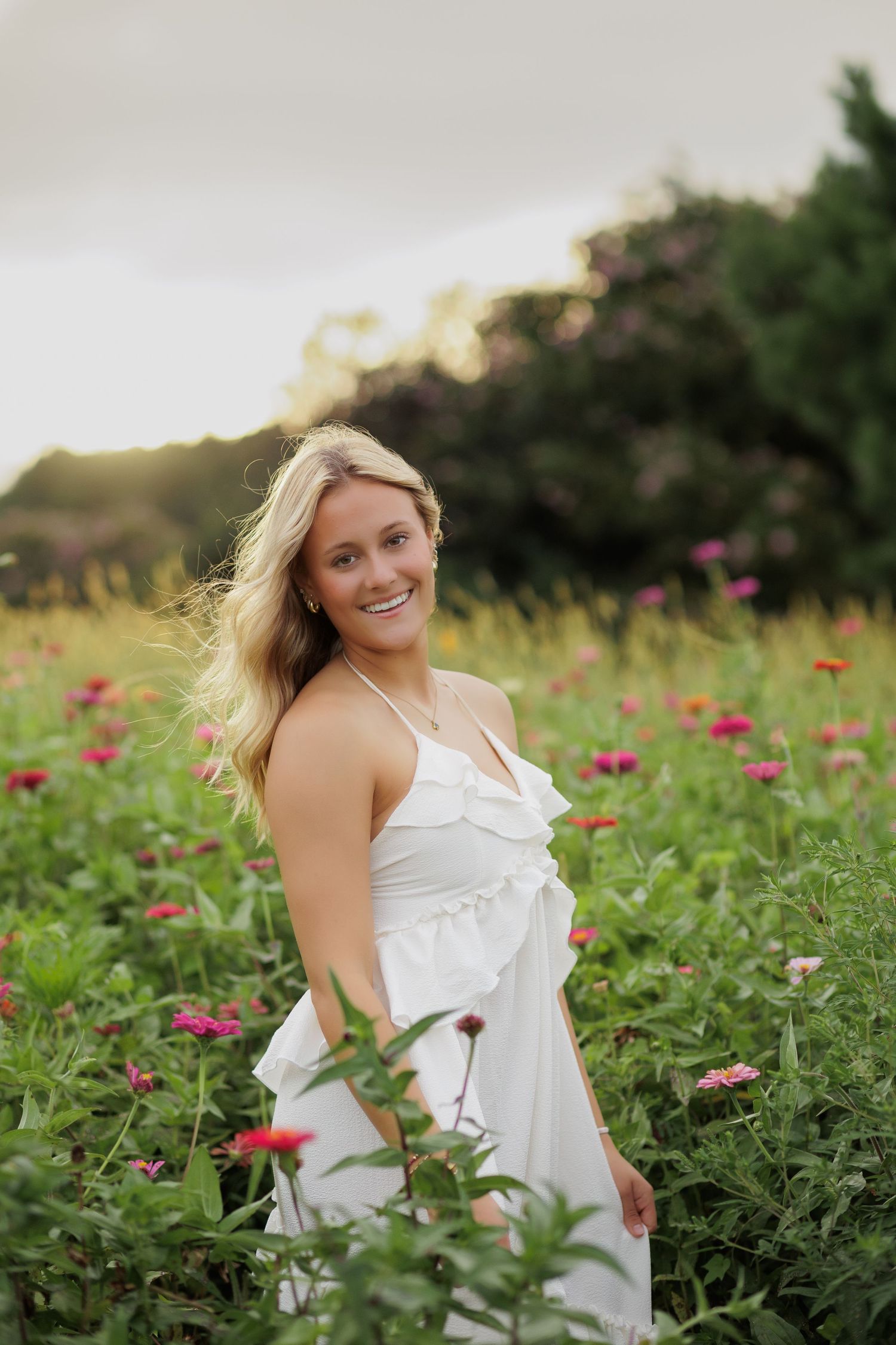 Senior Photo Session at Dix Parks in Raleigh, NC in flower field in the summer.