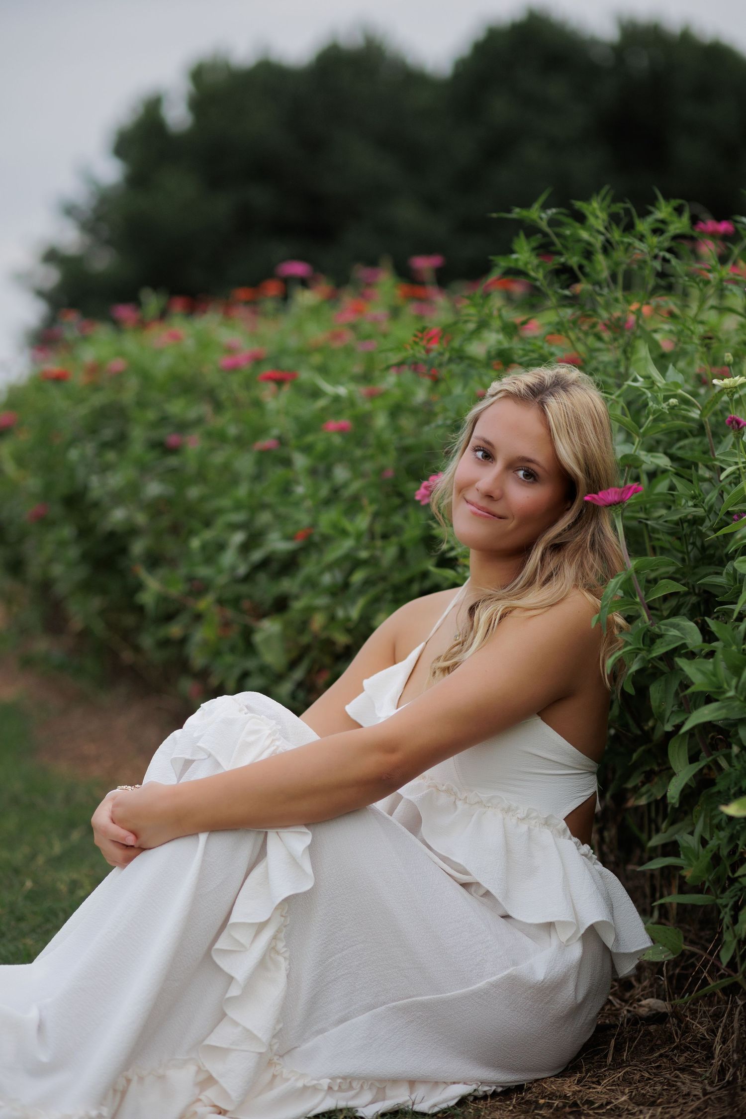 Wake Forest Senior Portraits in a flower field at Dix Park in Raleigh, NC Golden Hour