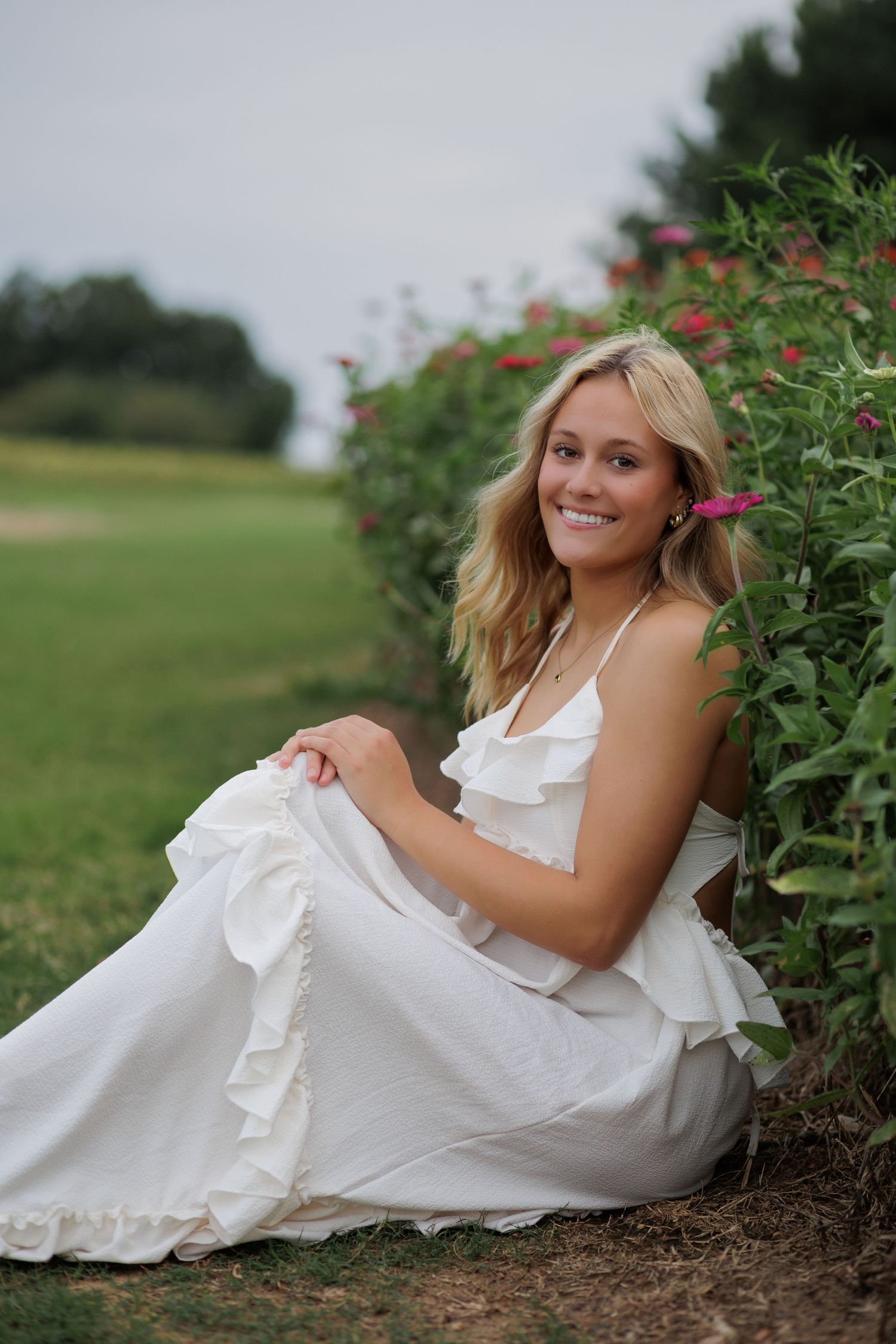 Wake Forest Senior Portraits in a flower field at Dix Park in Raleigh, NC Golden Hour