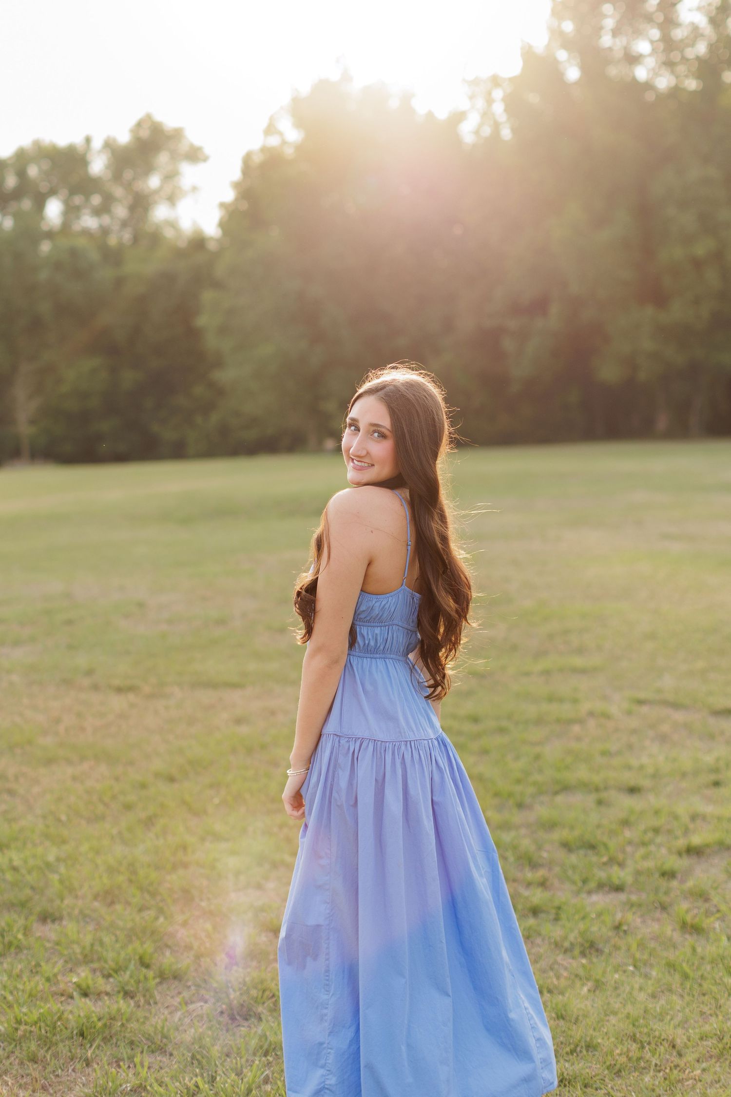 Wake Forest Senior Session at Horseshoe Farm in field during golden hour in Raleigh, NC.