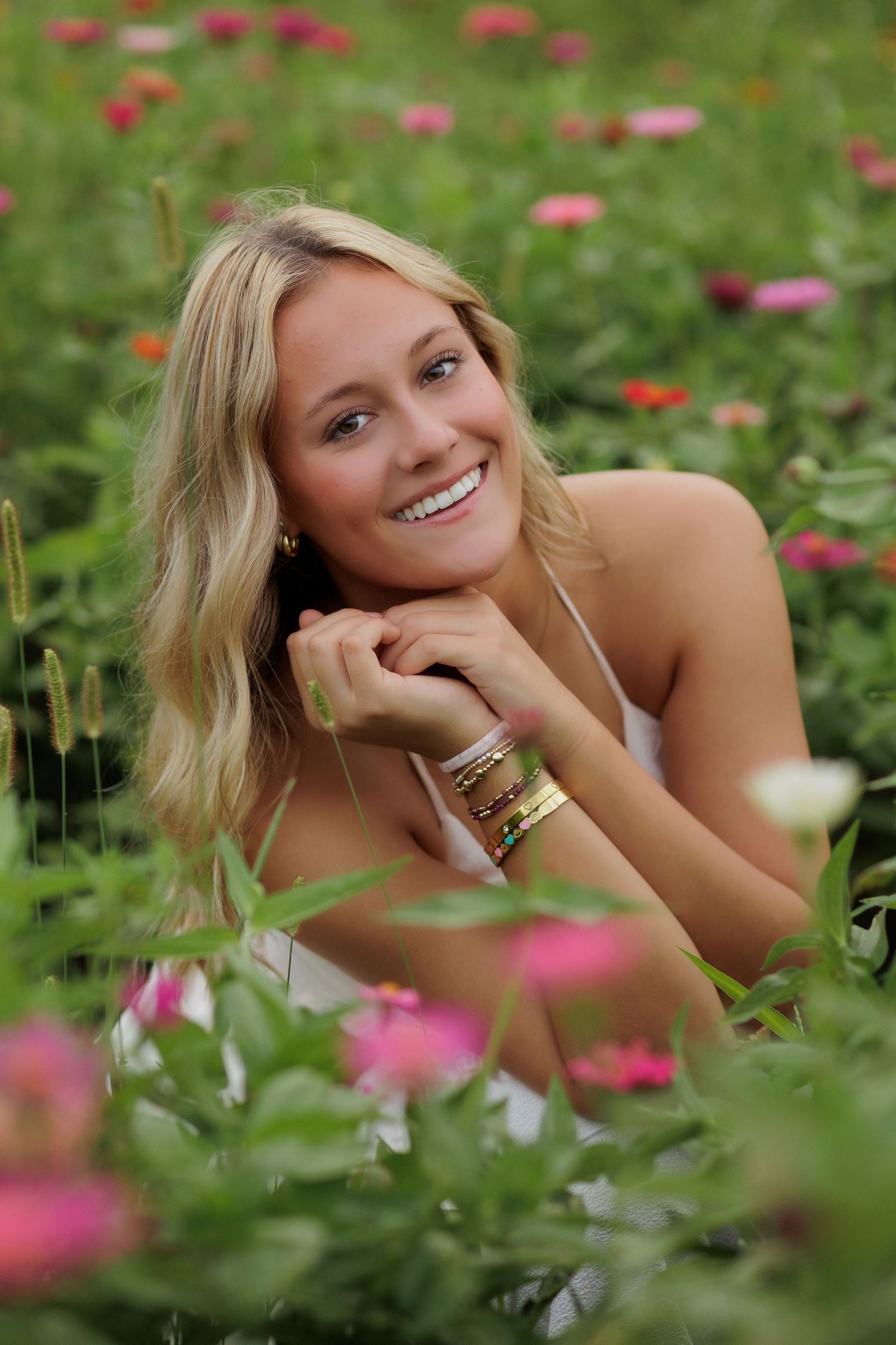 Wake Forest Senior Portraits in a flower field at Dix Park in Raleigh, NC Golden Hour