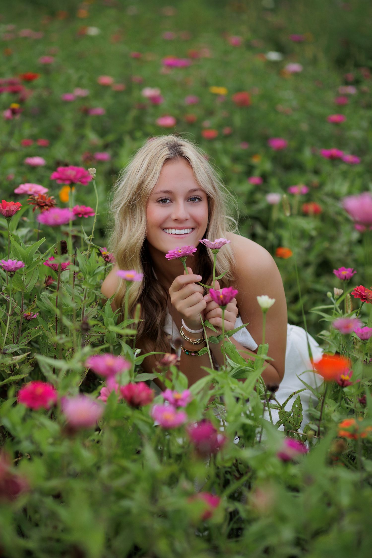 Wake Forest Senior Portraits in a flower field at Dix Park in Raleigh, NC Golden Hour