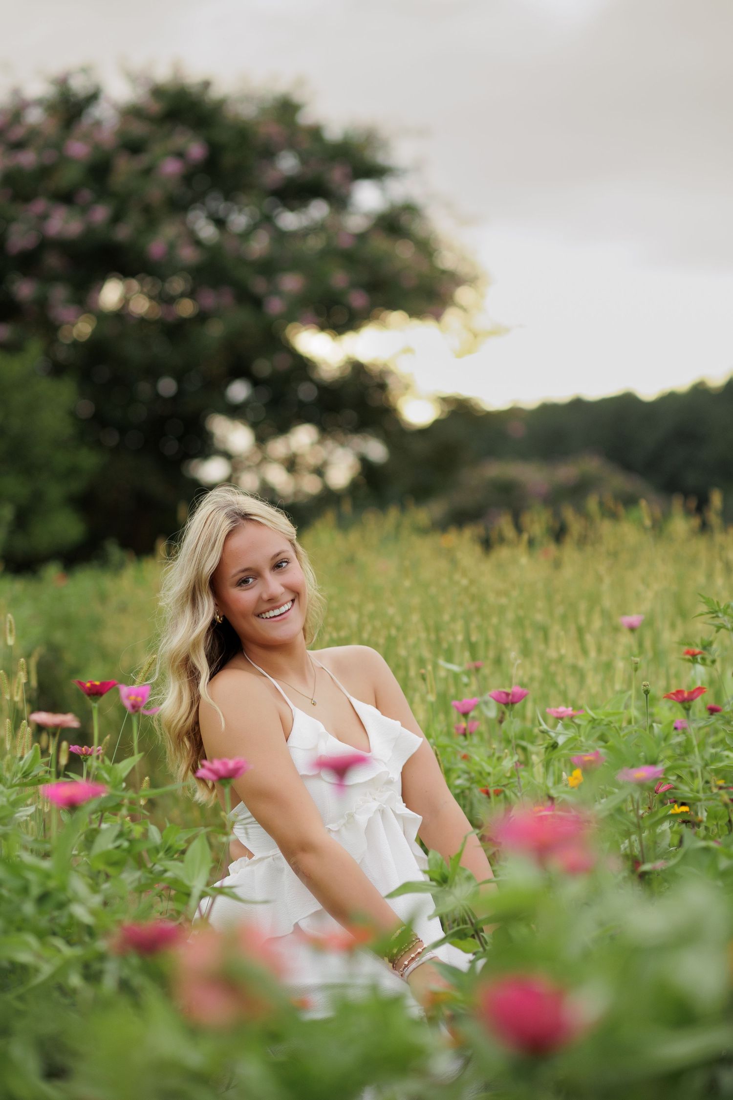 Wake Forest Senior Portraits in a flower field at Dix Park in Raleigh, NC Golden Hour