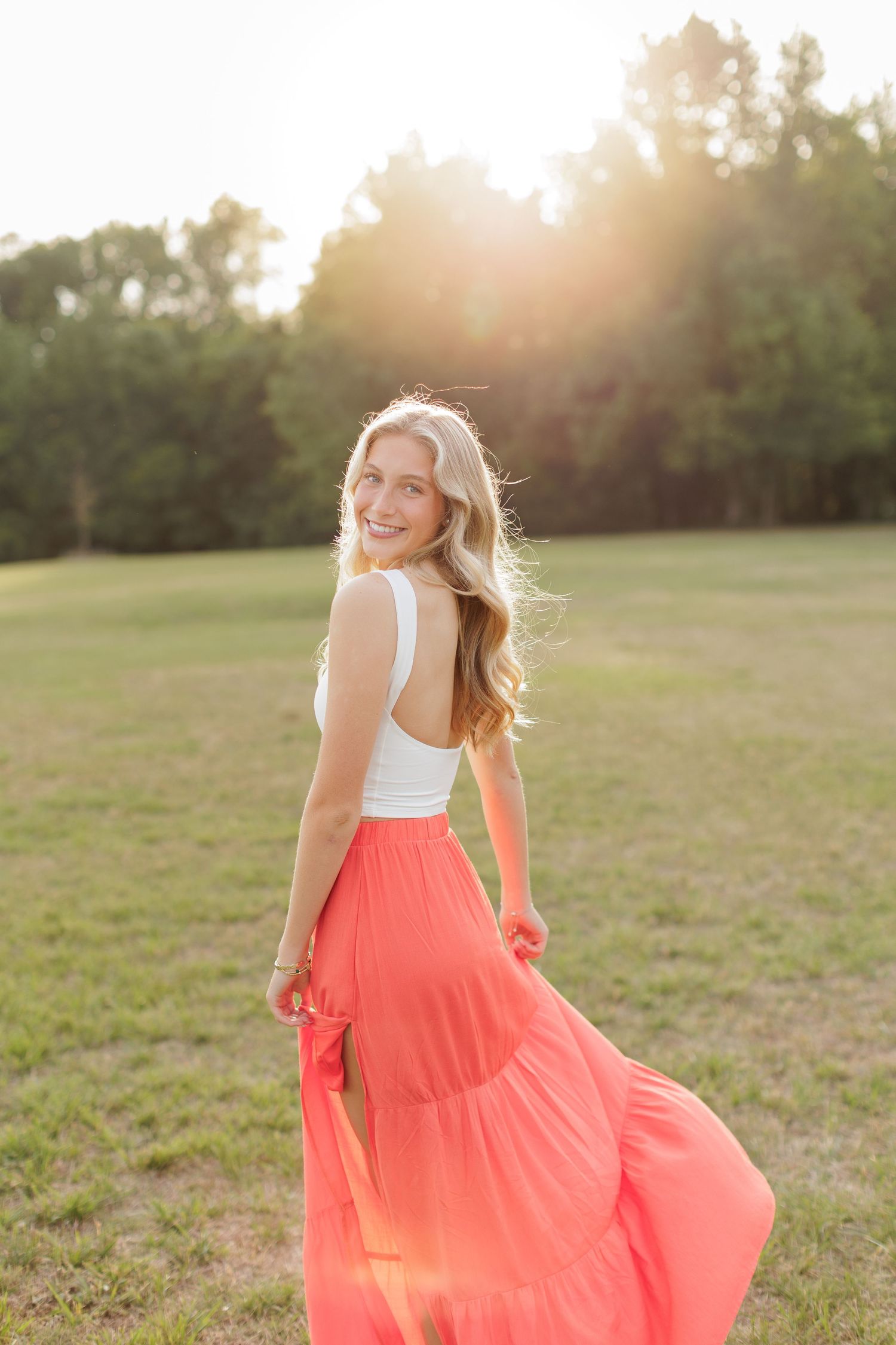 Wake Forest Senior Session at Horseshoe Farm in field during golden hour in Raleigh, NC.