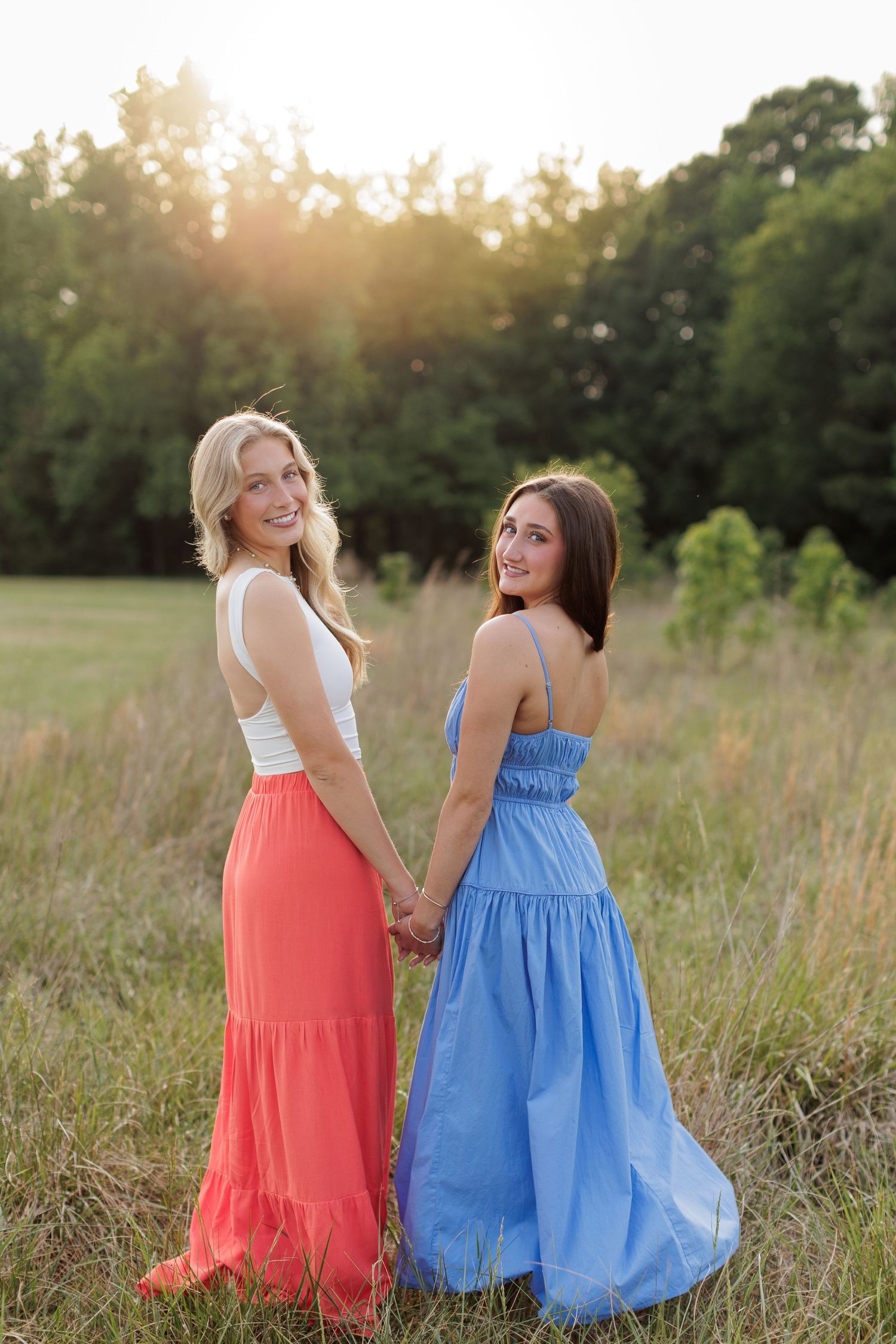 Wake Forest Best Friend Senior Session at Horseshoe Farm in field at sunset in Raleigh, NC.