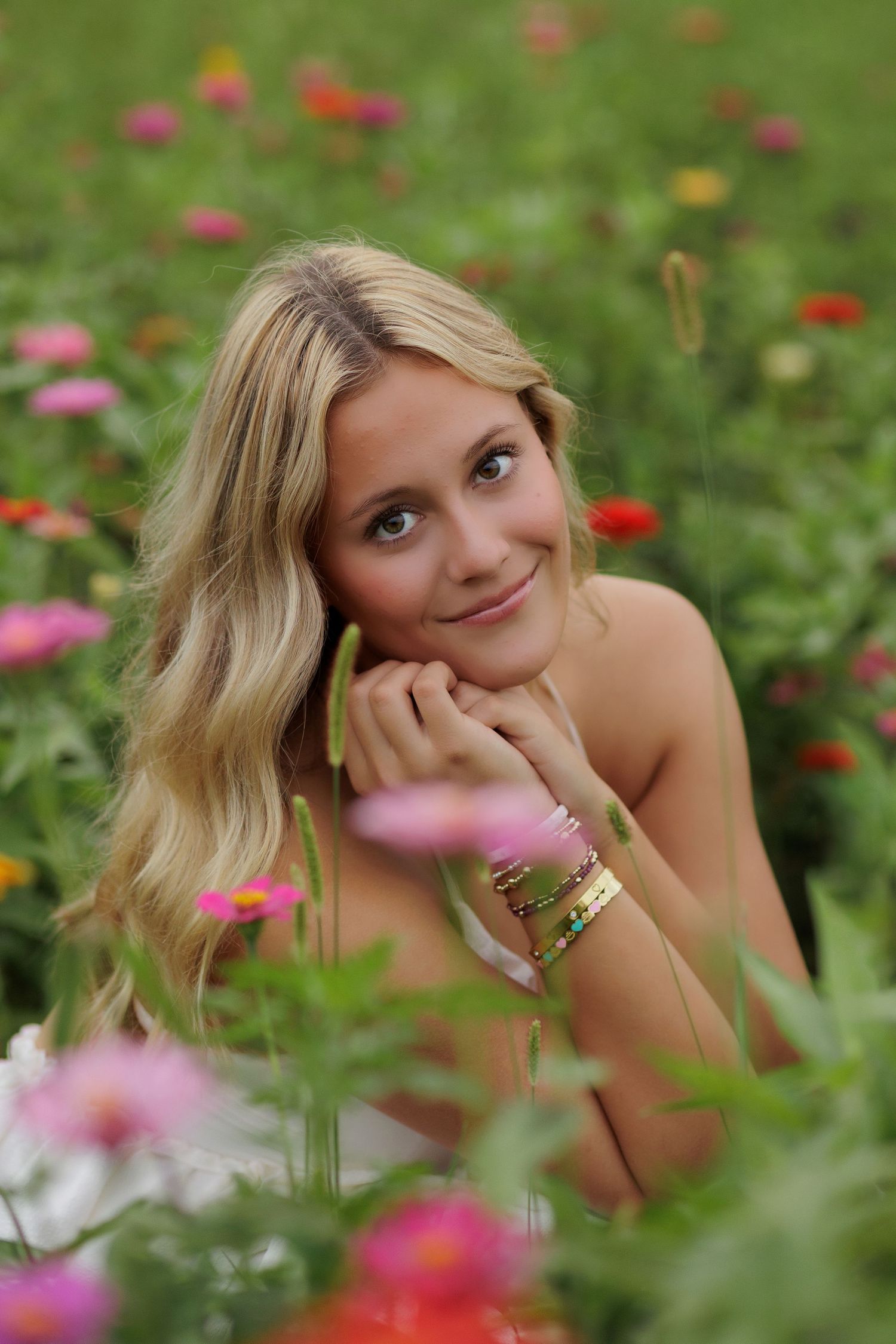 Wake Forest Senior Portraits in a flower field at Dix Park in Raleigh, NC Golden Hour