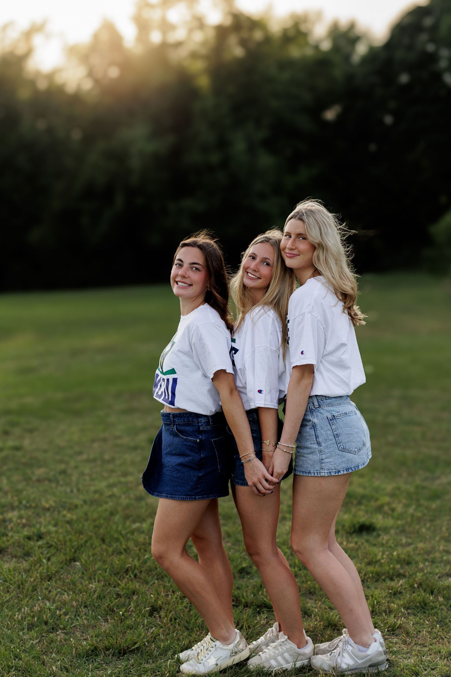 Wake Forest senior best friends college decision mini session in field at sunset at Horseshoe Farms in Raleigh, NC.