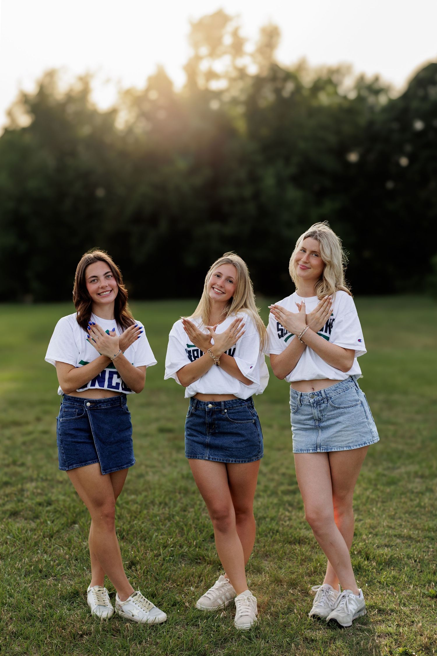 Wake Forest senior best friends college decision mini session in field at sunset at Horseshoe Farms in Raleigh, NC.