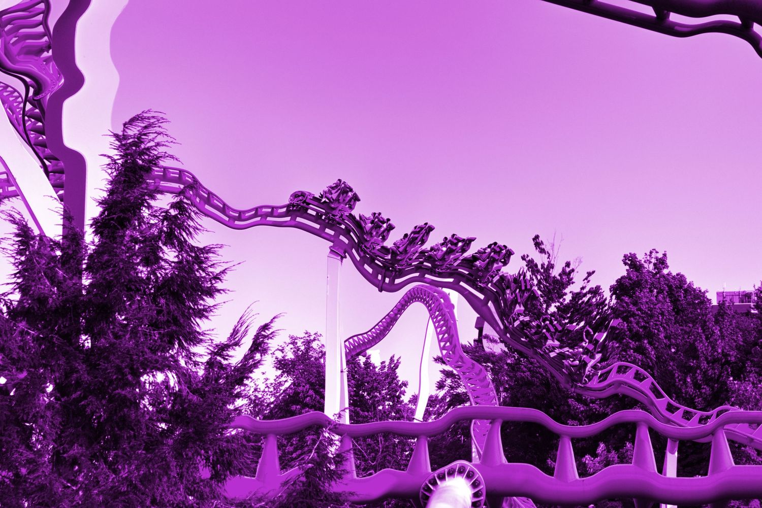 A rollercoaster in a dreamy state, warped with waves, and colored with a purple-pink hue.