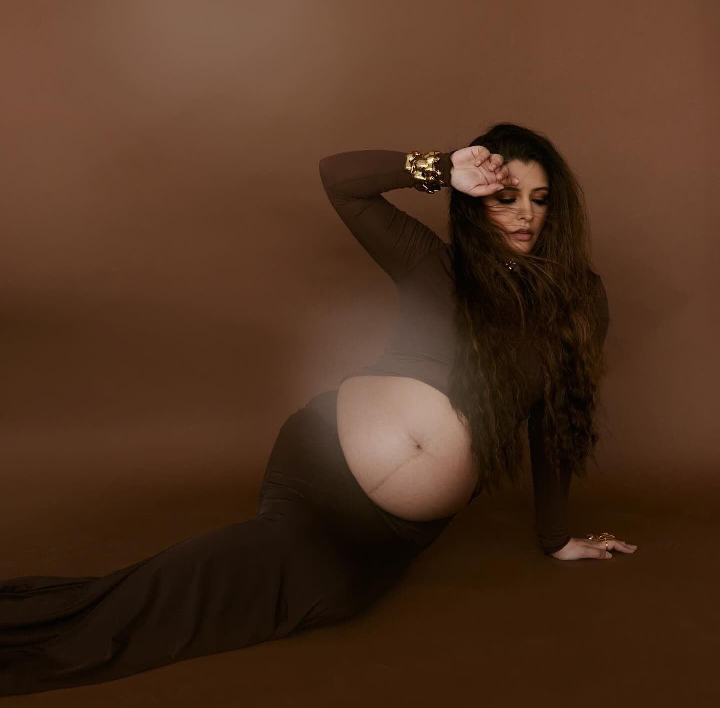 Artistic brown-toned maternity photos showing elegant poses and dramatic lighting.