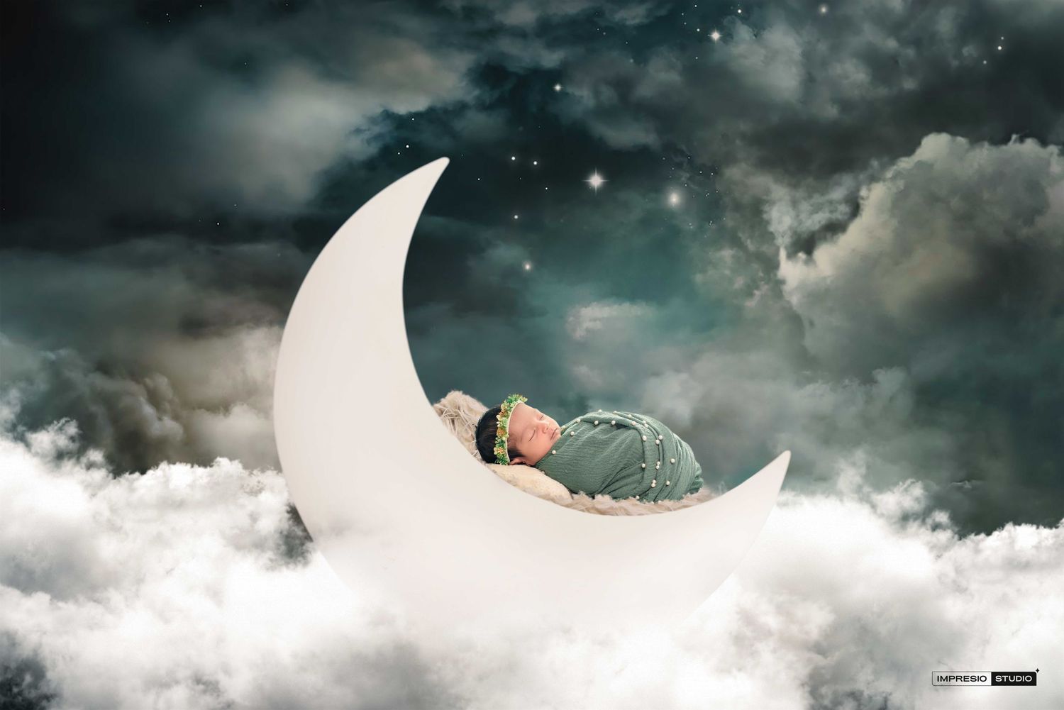 Newborn baby sleeping peacefully on a crescent moon among clouds in a dreamy night sky digital composite photo.