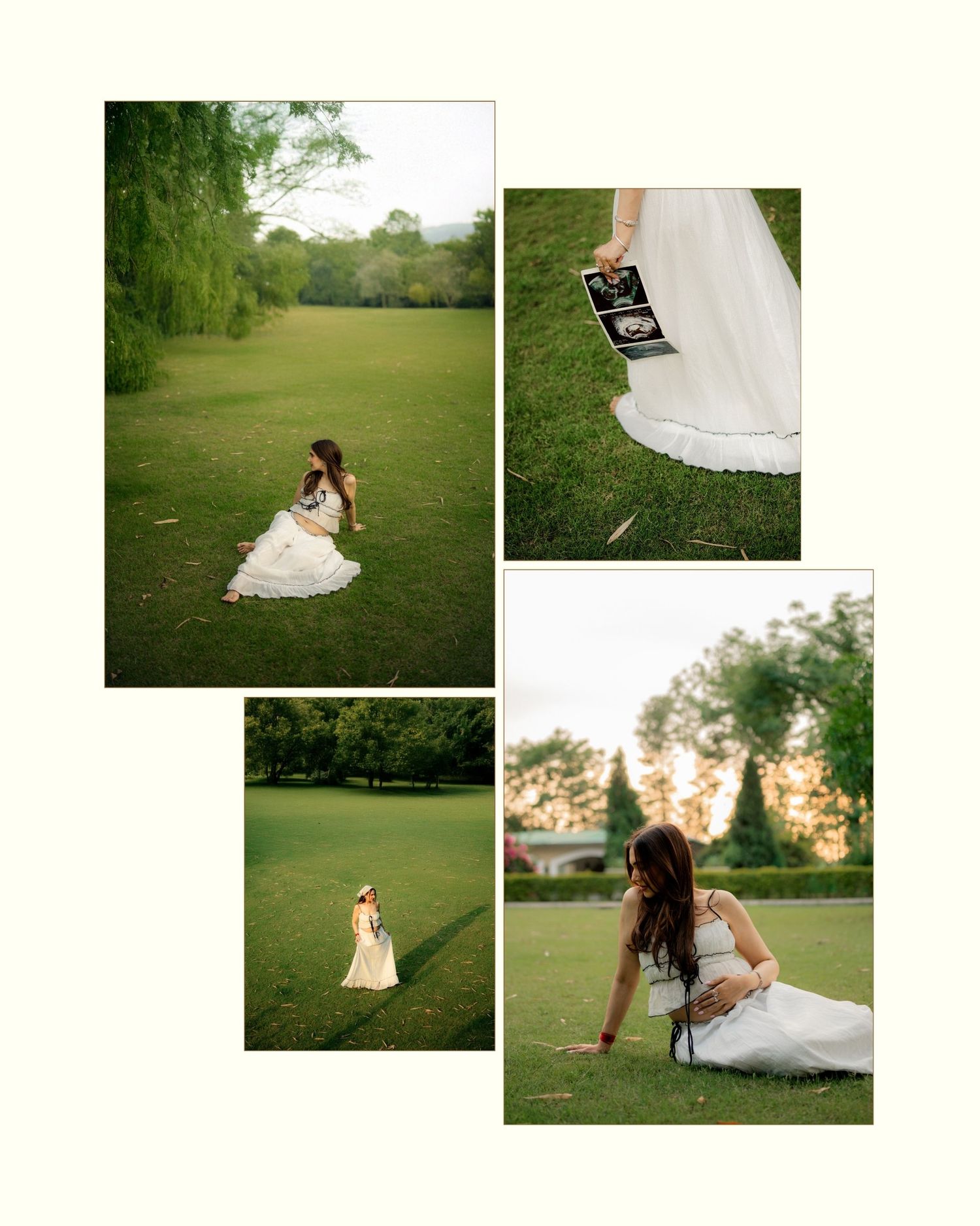 Pregnant woman in white dress sitting on lush green grass holding ultrasound photo during outdoor maternity photoshoot.