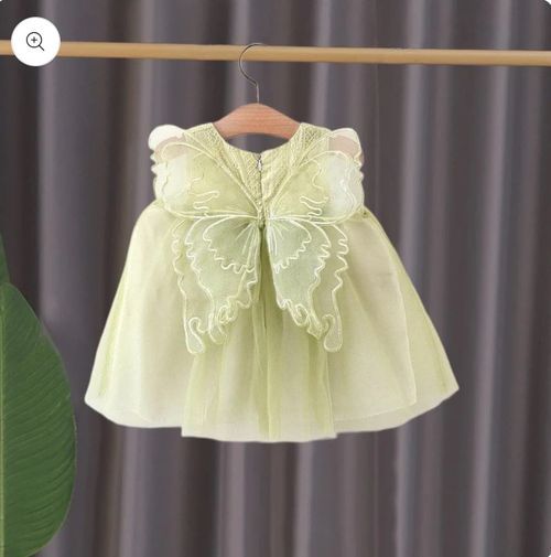 Mint green baby dress with large butterfly detail on front.