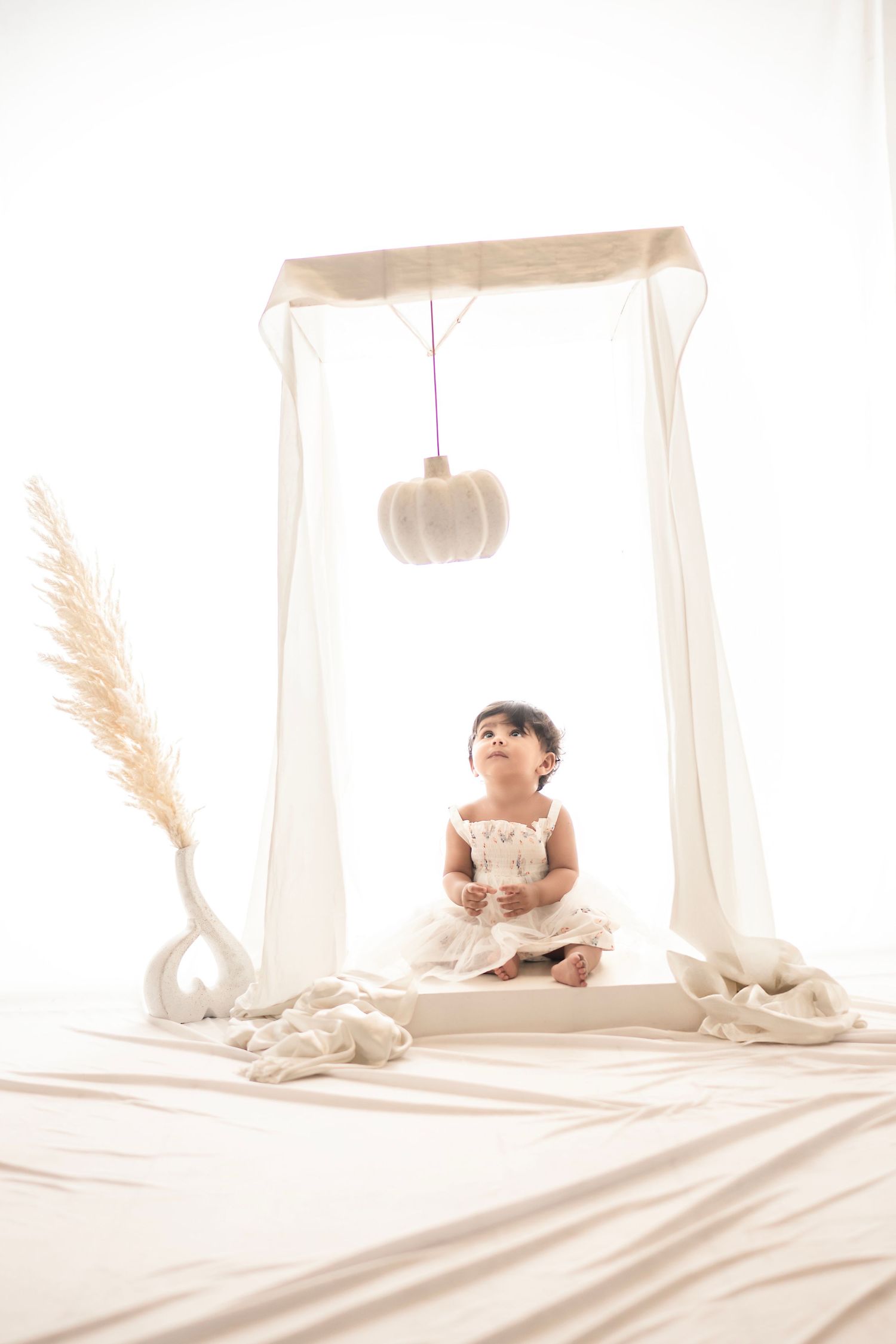 First birthday photoshoot near me with joyful candid shots – Impresio Studio
