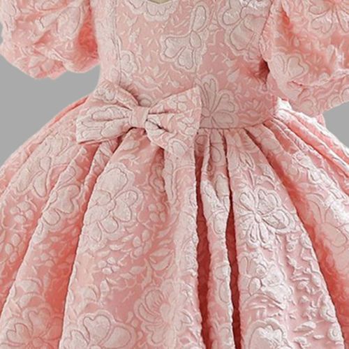Delicate pink lace and floral pattern details on a formal dress fabric shown in close-up view.