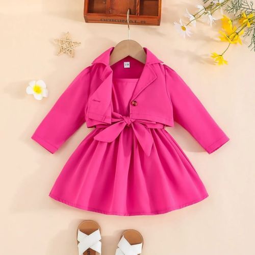Bright fuchsia baby dress with bow accent and pleated skirt design.