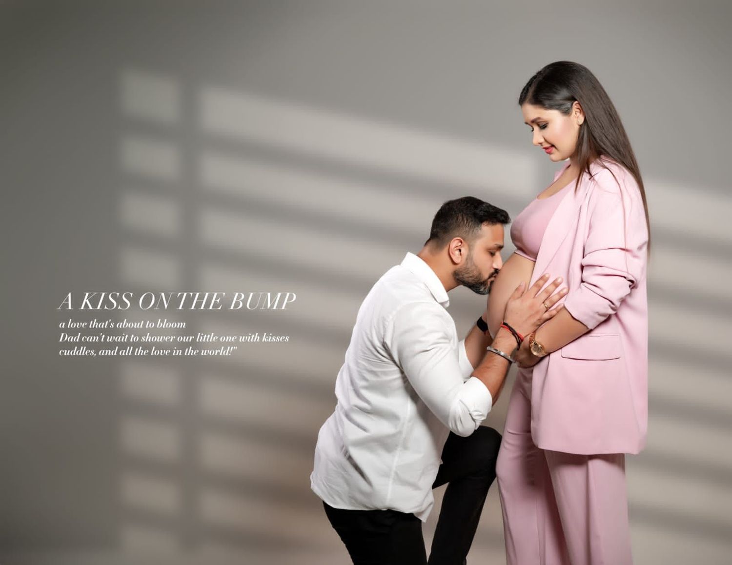 Artistic maternity photos with dramatic window lighting and pink formal attire.