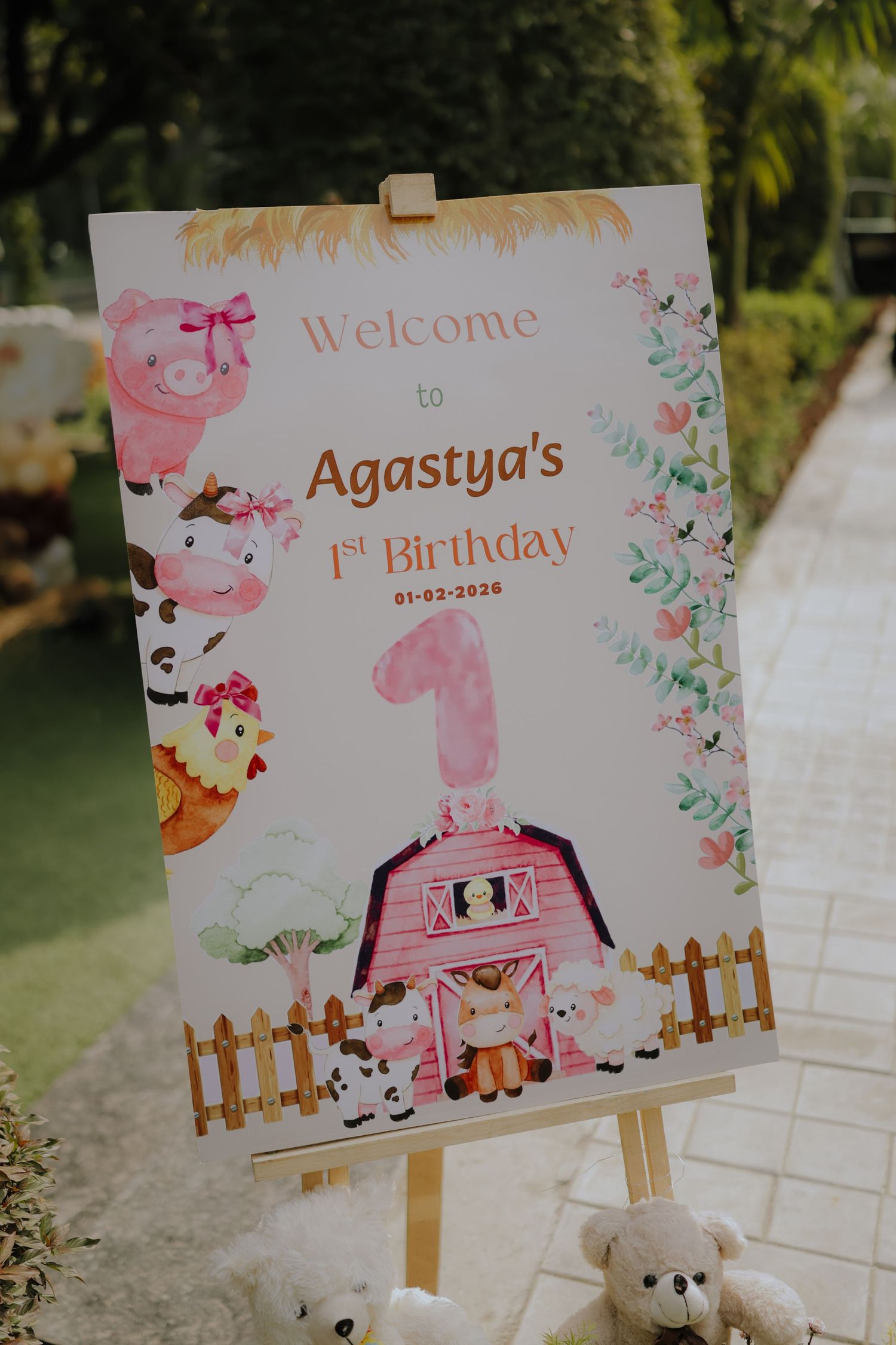 Farm-themed welcome sign for Agastya's 1st birthday party on 01-02-2020, featuring cute animals and a pink barn.