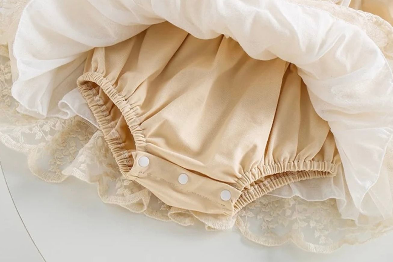 Three elegant beige ruffled fabric details with textured patterns and gathered edges displayed in a row.