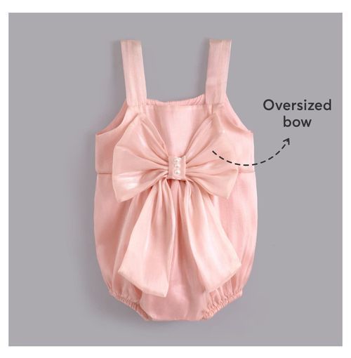 Pink baby romper with oversized decorative bow on the front.